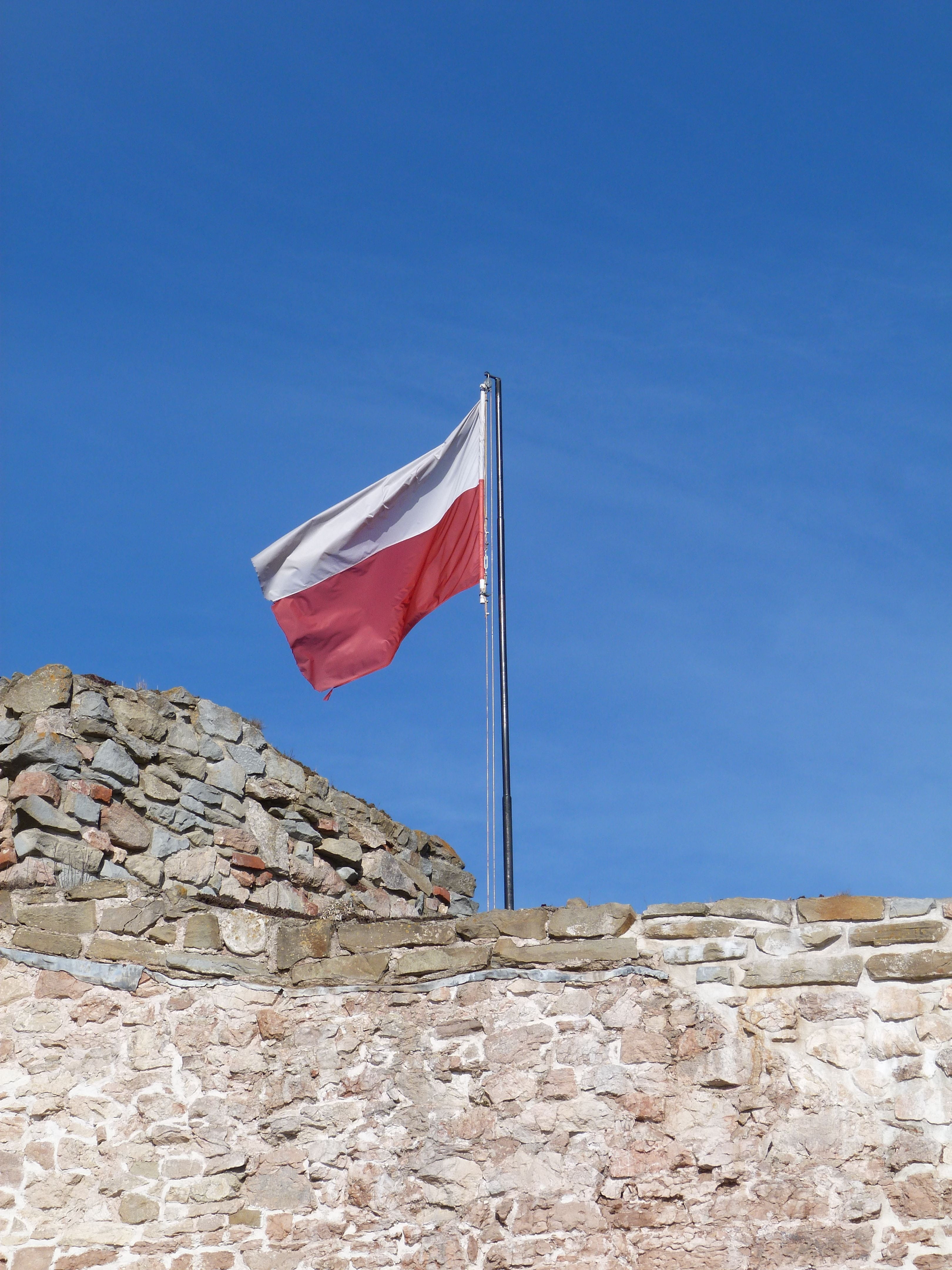 stone wall, 4K, clear sky, sunlight, national icon, blue, no people, day, low angle view, wind, poland, patriotism, environment, architecture, built structure, Phone HD Wallpaper