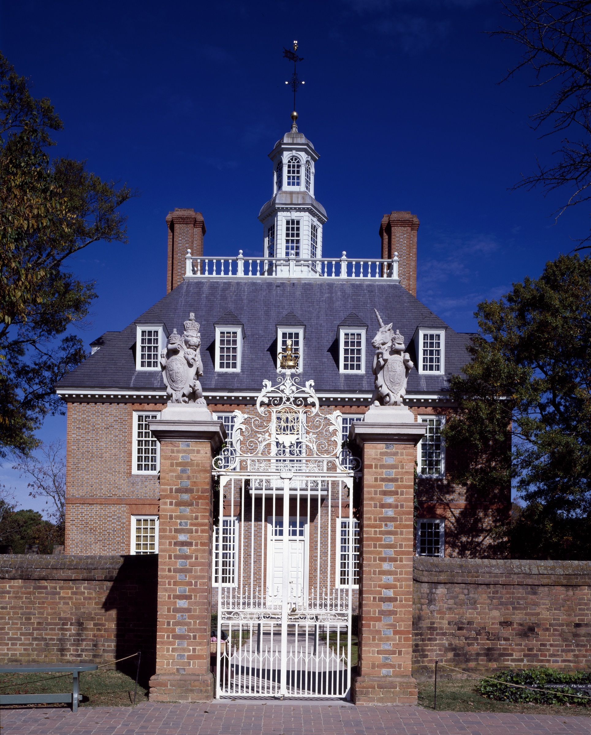 low angle view, no people, built structure, tower, gate, wrought iron, facade, historic, landmark, brick, plant, blue, outdoors, sky, governors palace, Phone HD Wallpaper