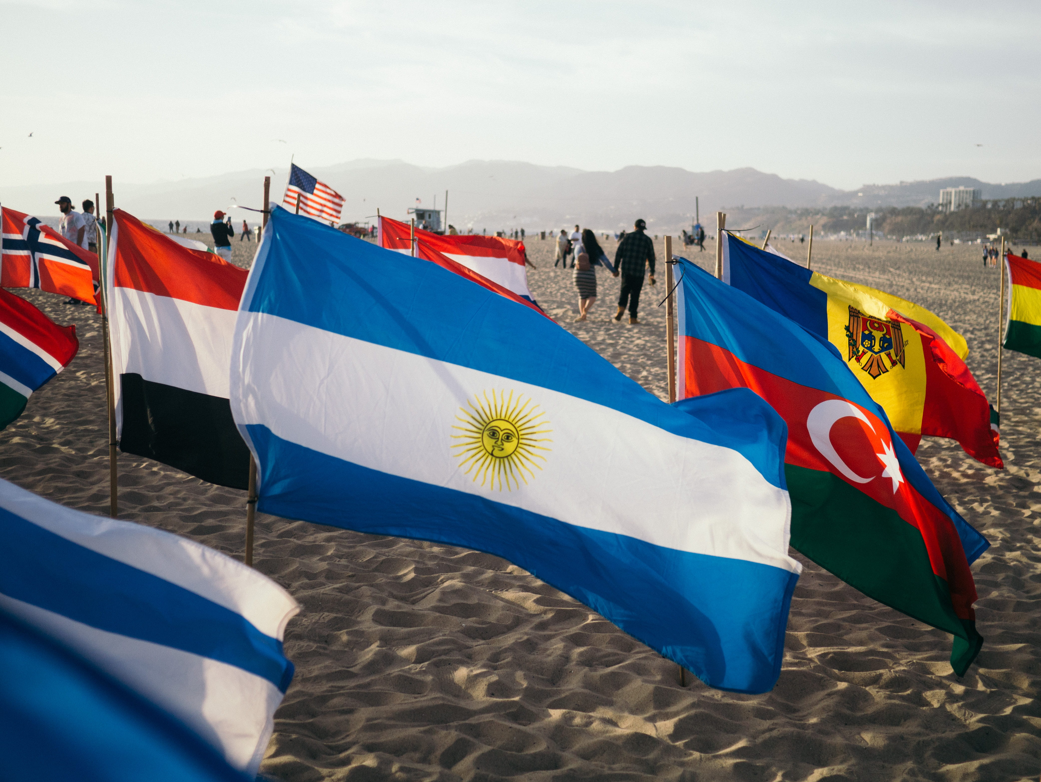argentina, sand, wind, beach life, textile, bandernas, 4K, white, multi colored, bandera, sky, no people, united states, outdoors, national icon, santa monica, HD Wallpaper