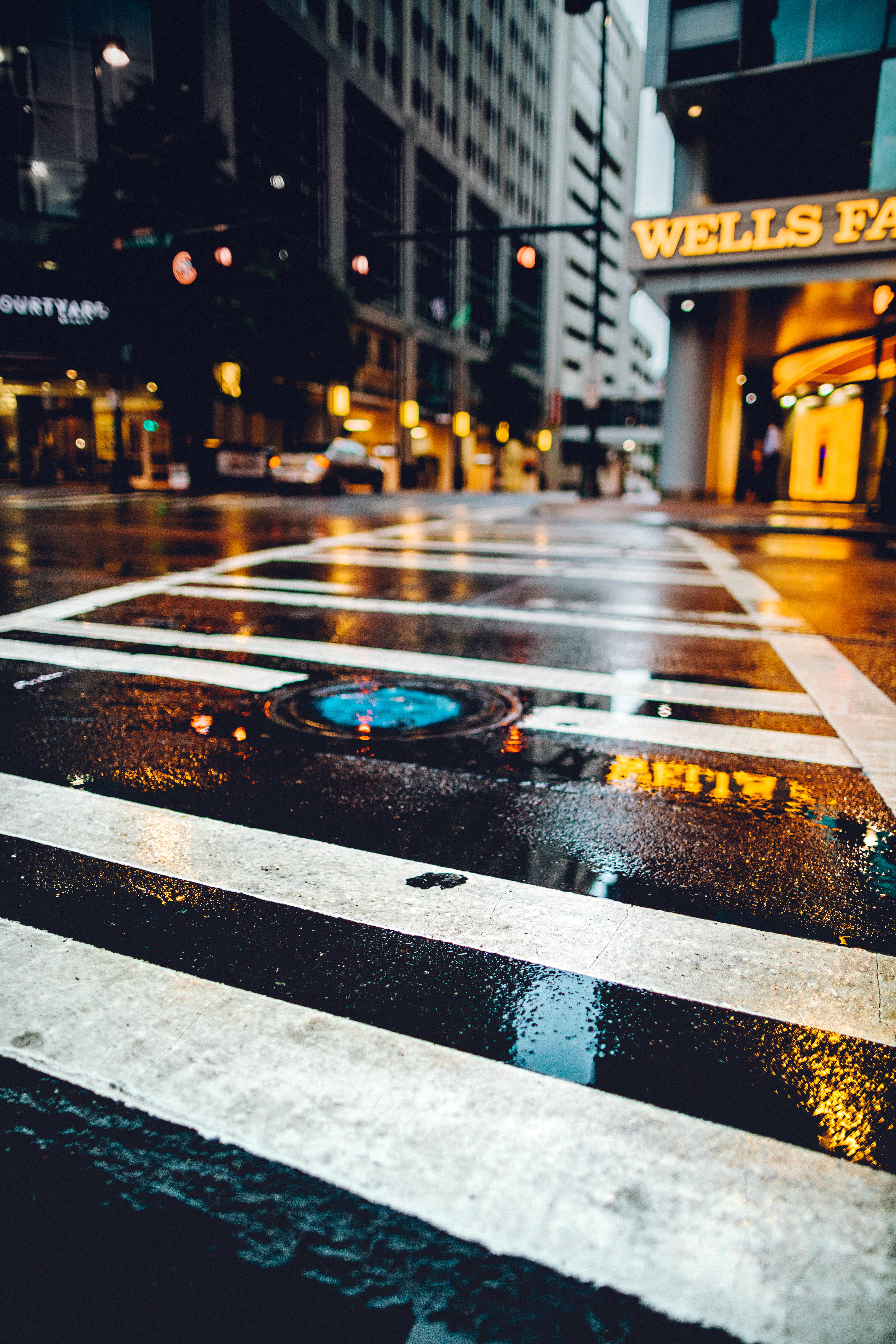 rain, building Exterior, intersection, built Structure, car, street Light, city, famous Place, mode of Transport, urban, asphalt, background, depth of field, Phone HD Wallpaper