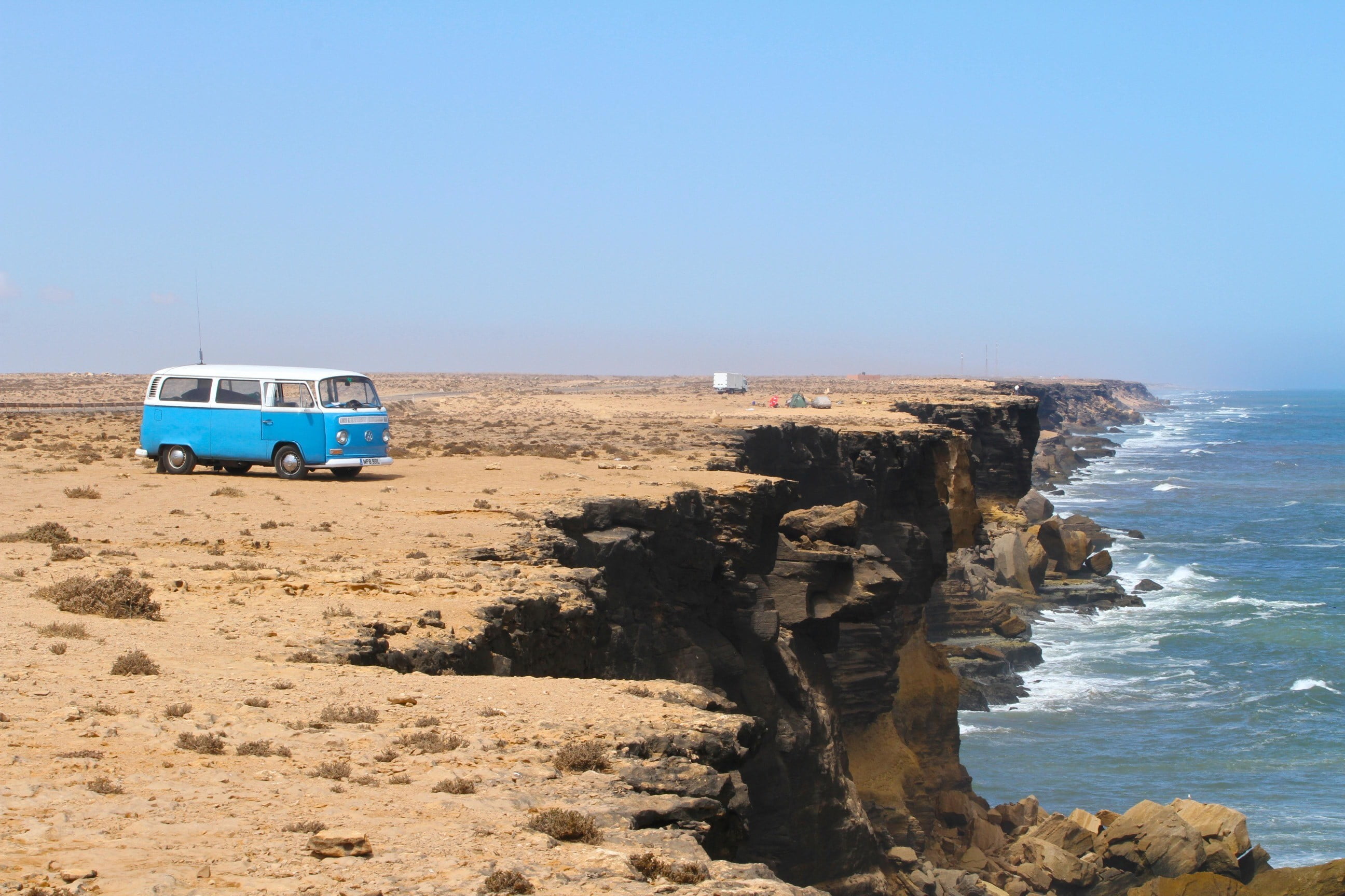 sea, motion, outdoors, rock, blue, rock formation, sky, no people, Volkswagen, 2K, bus, horizon over water, scenics - nature, rock - object, solid, cliff, HD Wallpaper