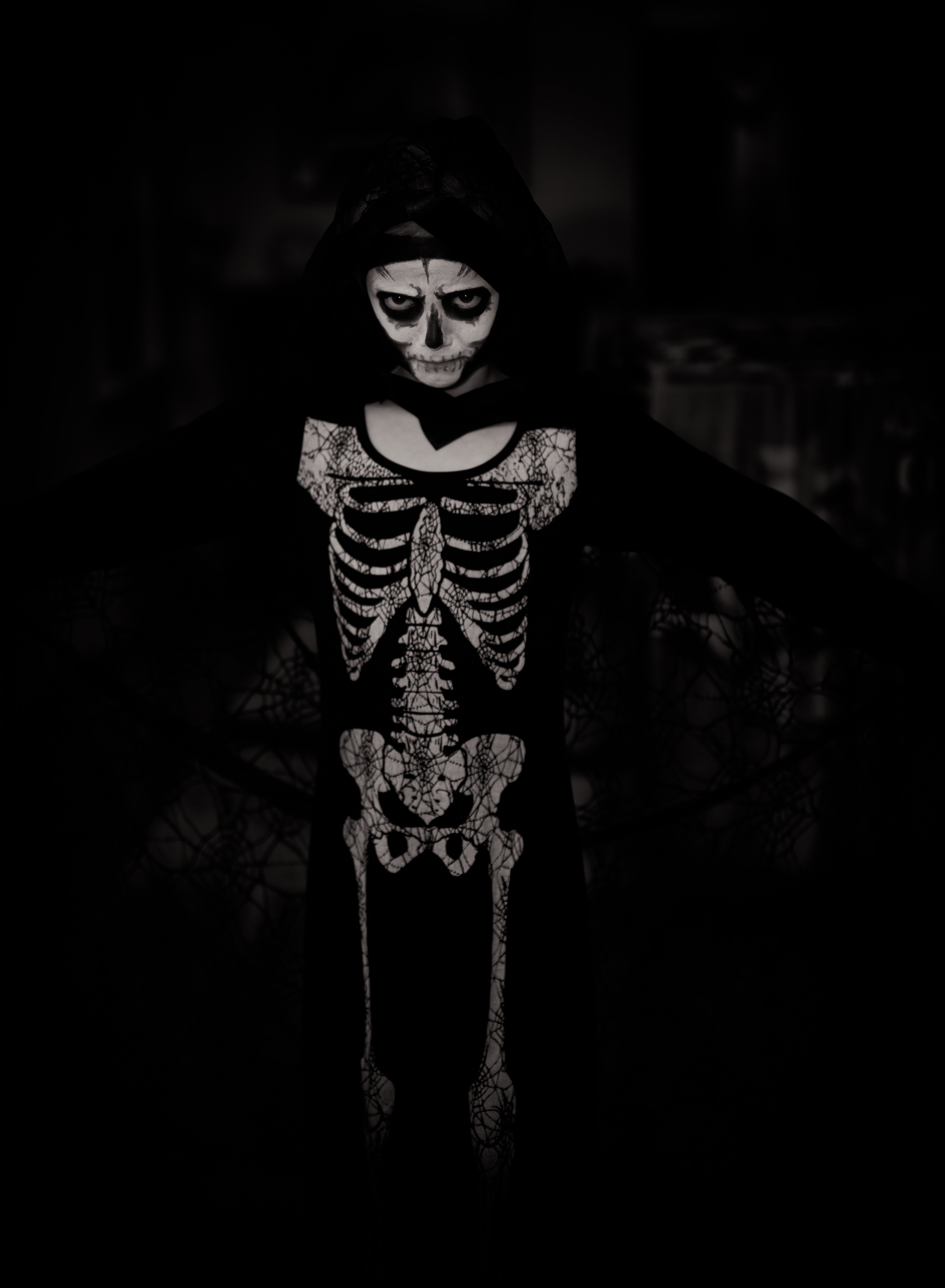 human skeleton, evil, front view, indoors, child, fear, dark, black, women, skeleton, bw, emotion, white, innocence, celebration, offspring, night, childhood, Phone HD Wallpaper