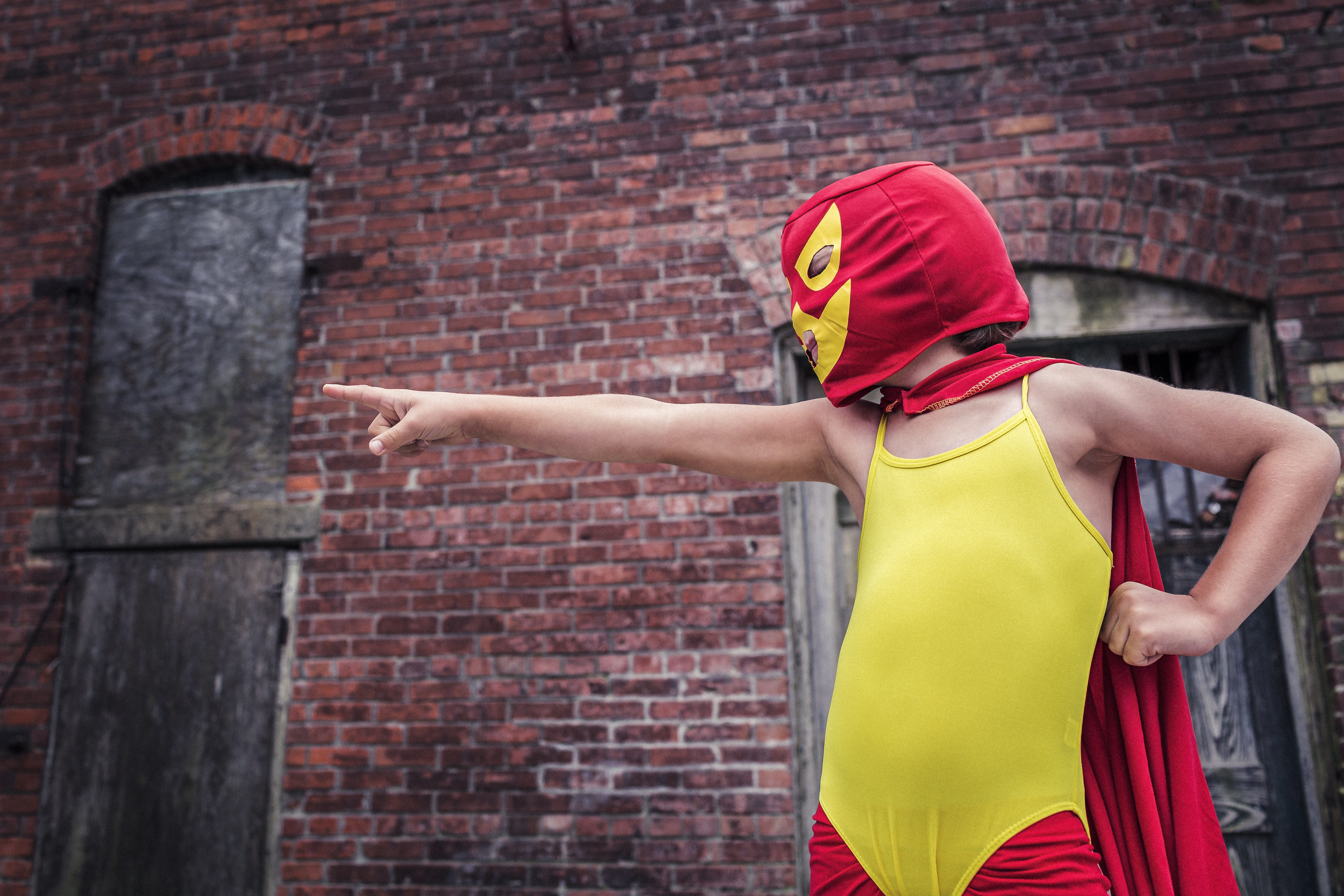 architecture, arms raised, outdoors, day, safety, standing, mexican, yellow, people, adult, brick, crime, lazy, whimsical, action, human arm, human body part, HD Wallpaper