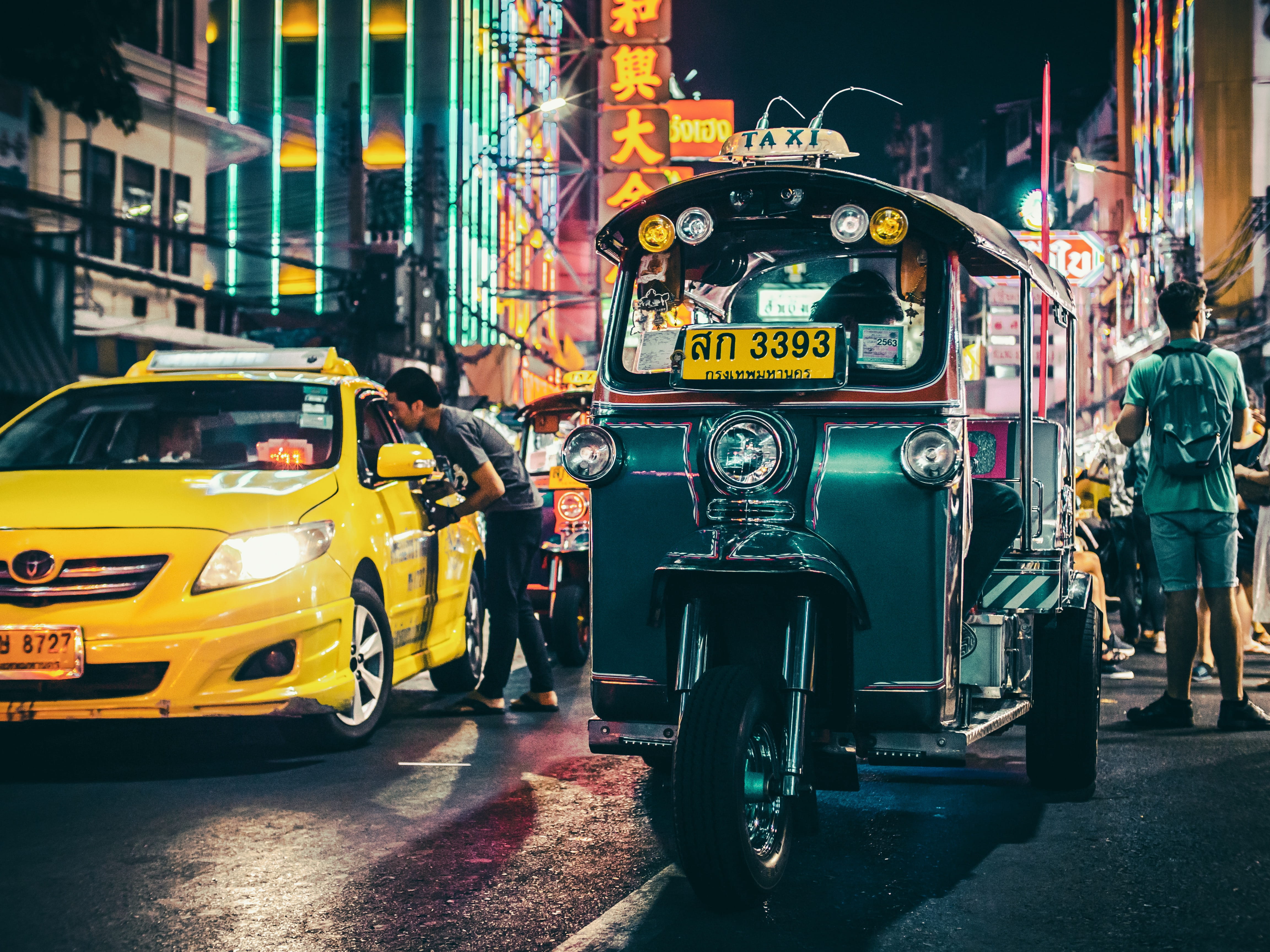 person, yellow, truck, motorcycle, architecture, real people, sports car, spoke, city life, people, metropolis, outdoors, urban, light, mode of transportation, HD Wallpaper