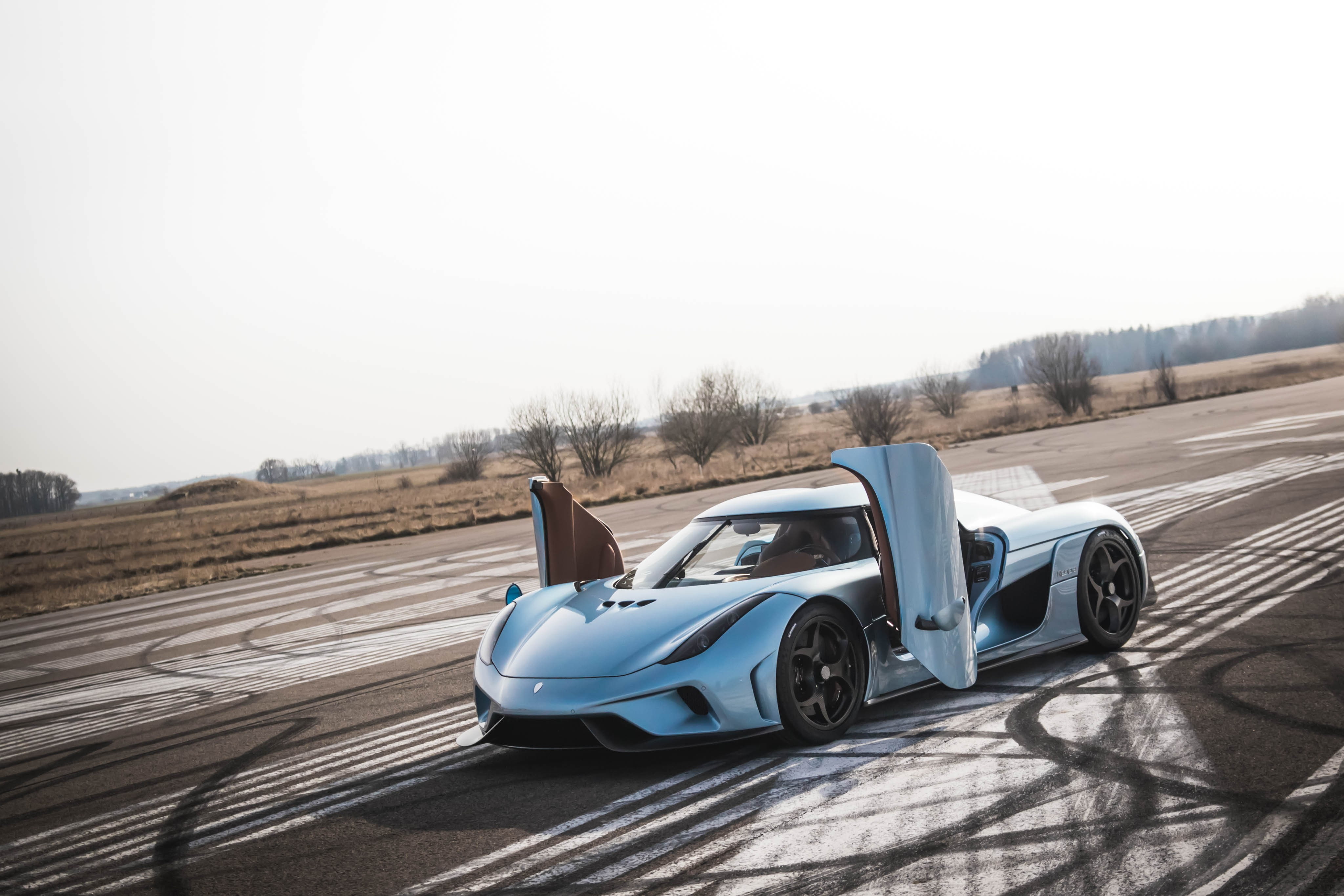 copy space, nature, 4K, Koenigsegg Regera, road, sunlight, sky, travel, motion, wheel, motor vehicle, land vehicle, transportation, parking, tire, car, HD Wallpaper
