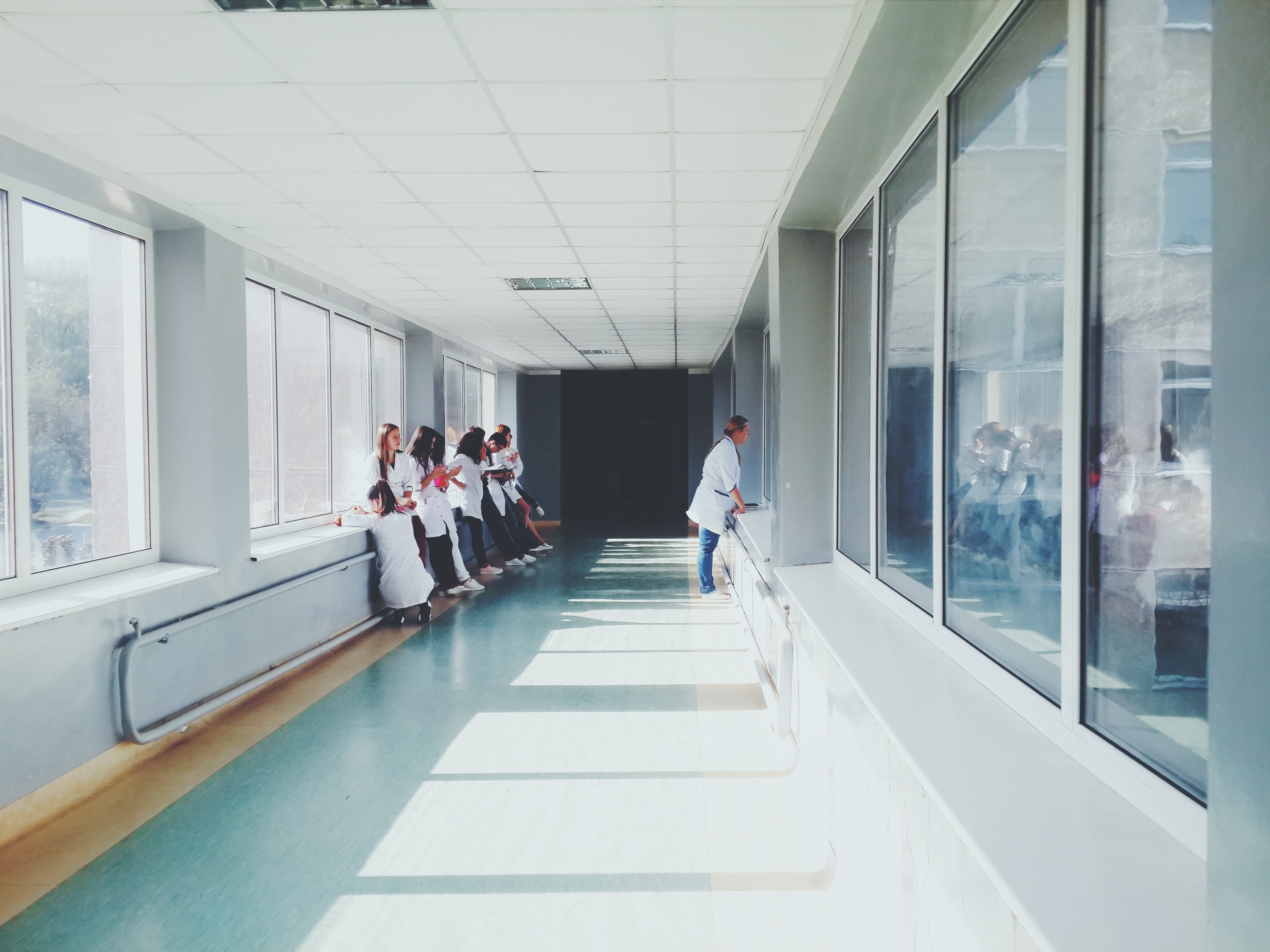 indoors, building, corridor, women, standing, glass, glass - material, hallway, group of people, group, doctors, window, people, arcade, coworker, day, HD Wallpaper