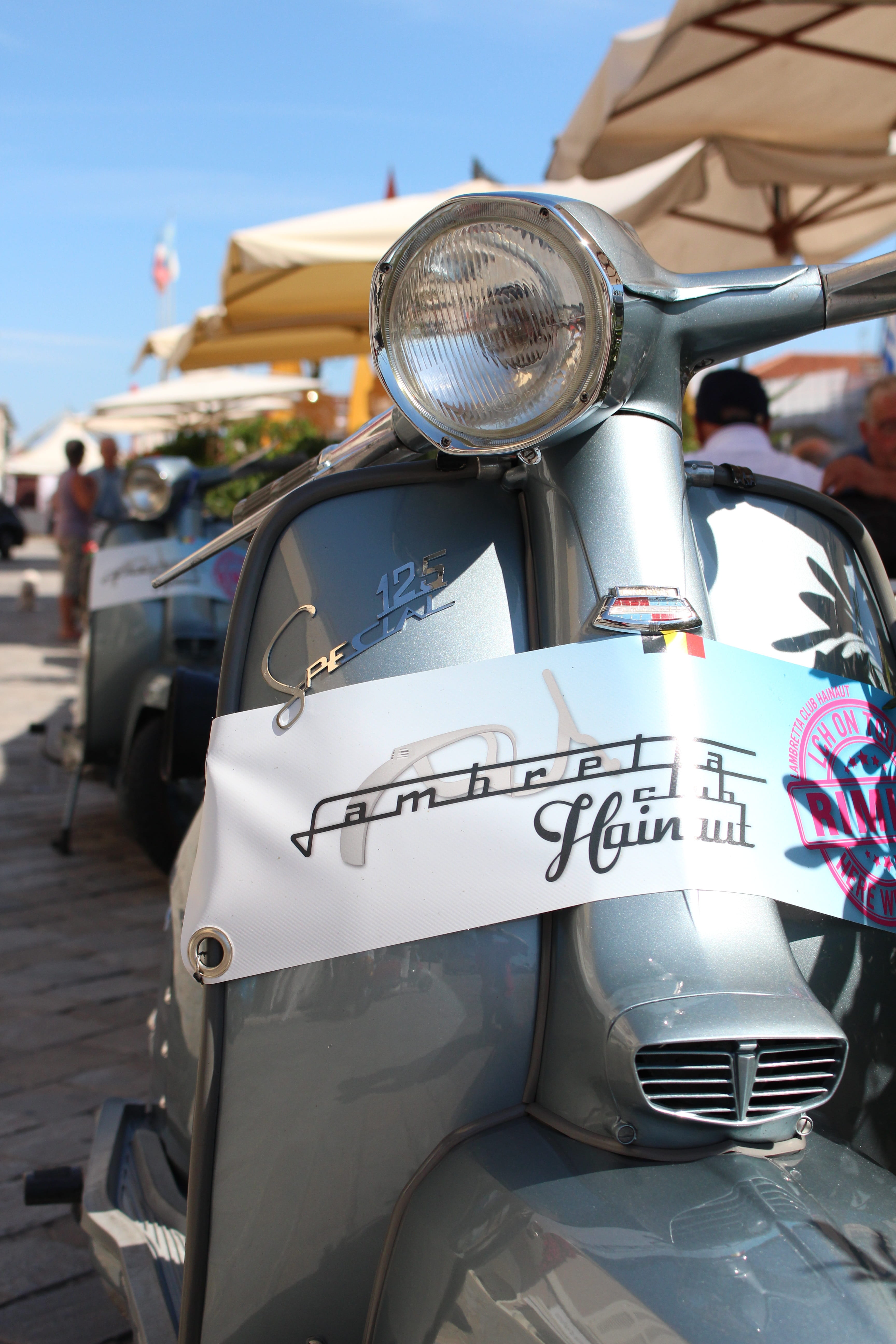 focus on foreground, city, transportation, land vehicle, text, communication, 5K, car, motorcycle, no people, lambretta, western script, street, scooter, Phone HD Wallpaper