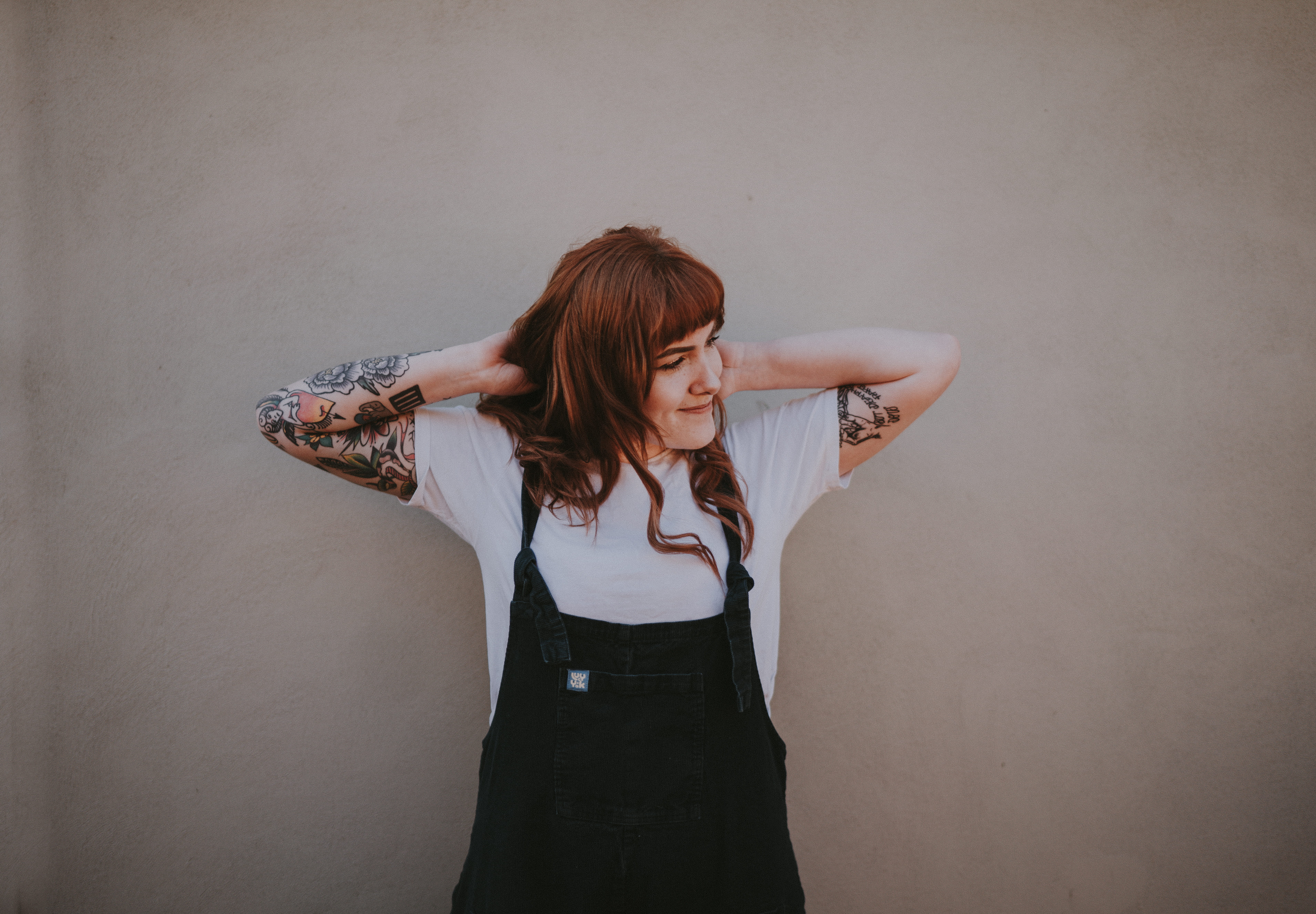 5K, lady, tattoo, white, overalls, brown, hairstyle, wall - building feature, caucasian, lifestyles, young adult, blank space, long hair, haired, dungaree, HD Wallpaper