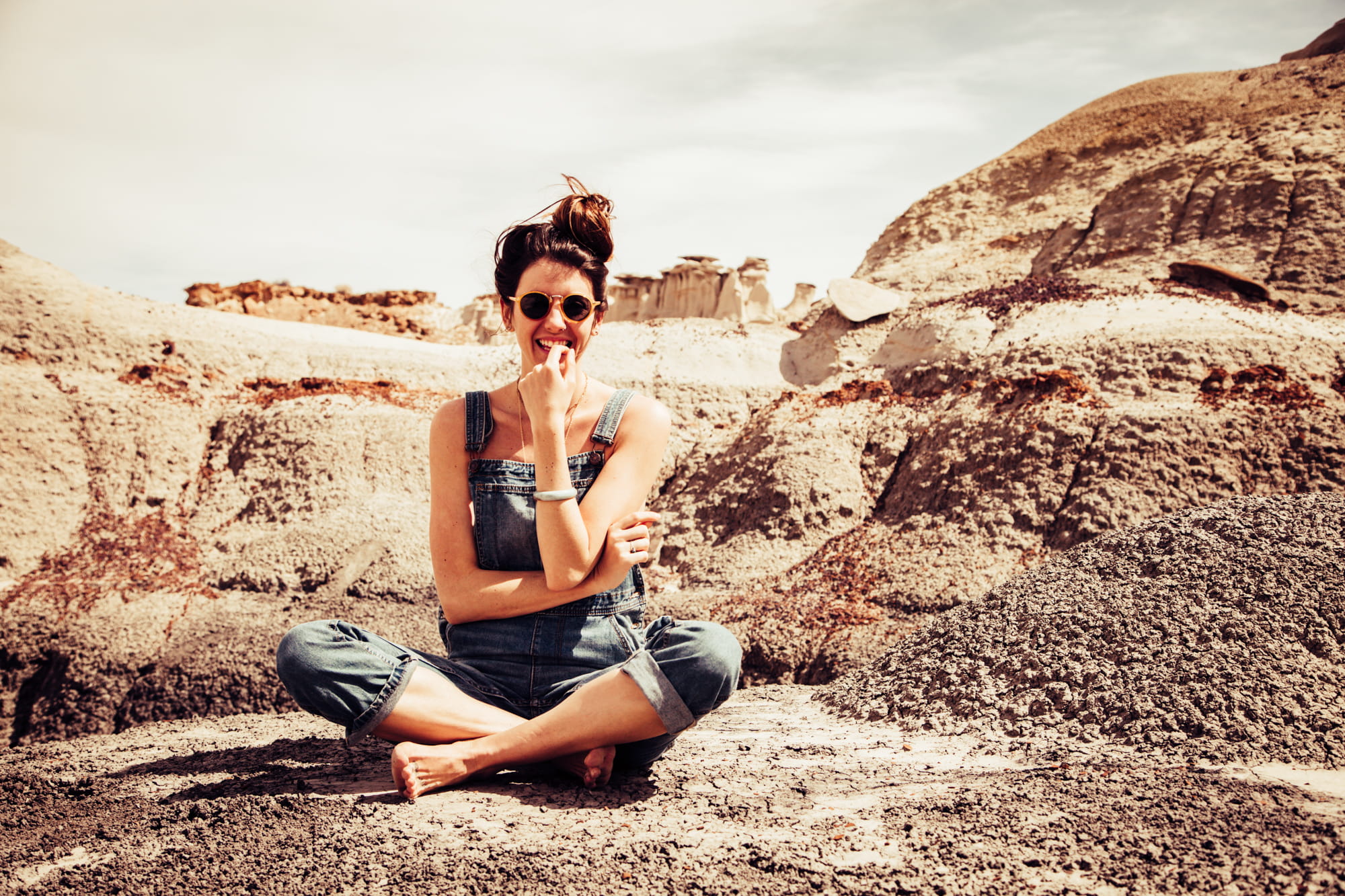 1080P, denim, full length, day, smiling, casual clothing, outdoors, rock, woman, solid, sitting, person, hair, one person, sand, girl, fashion, nature, HD Wallpaper