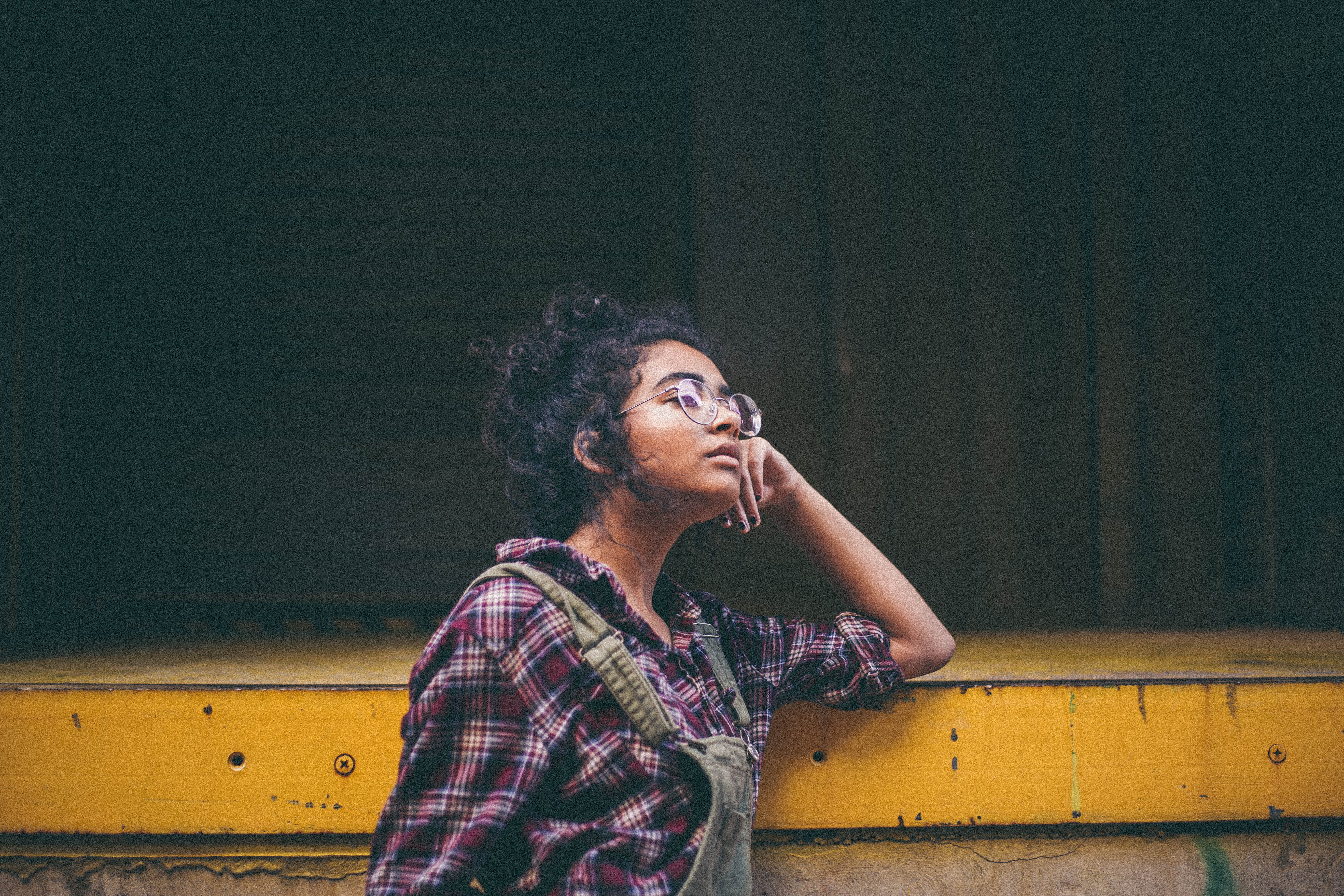 female, dungarees, 5K, yellow, one person, beautiful woman, young adult, girl, waist up, glasses, looking away, looking, looking up, real people, checked pattern, HD Wallpaper
