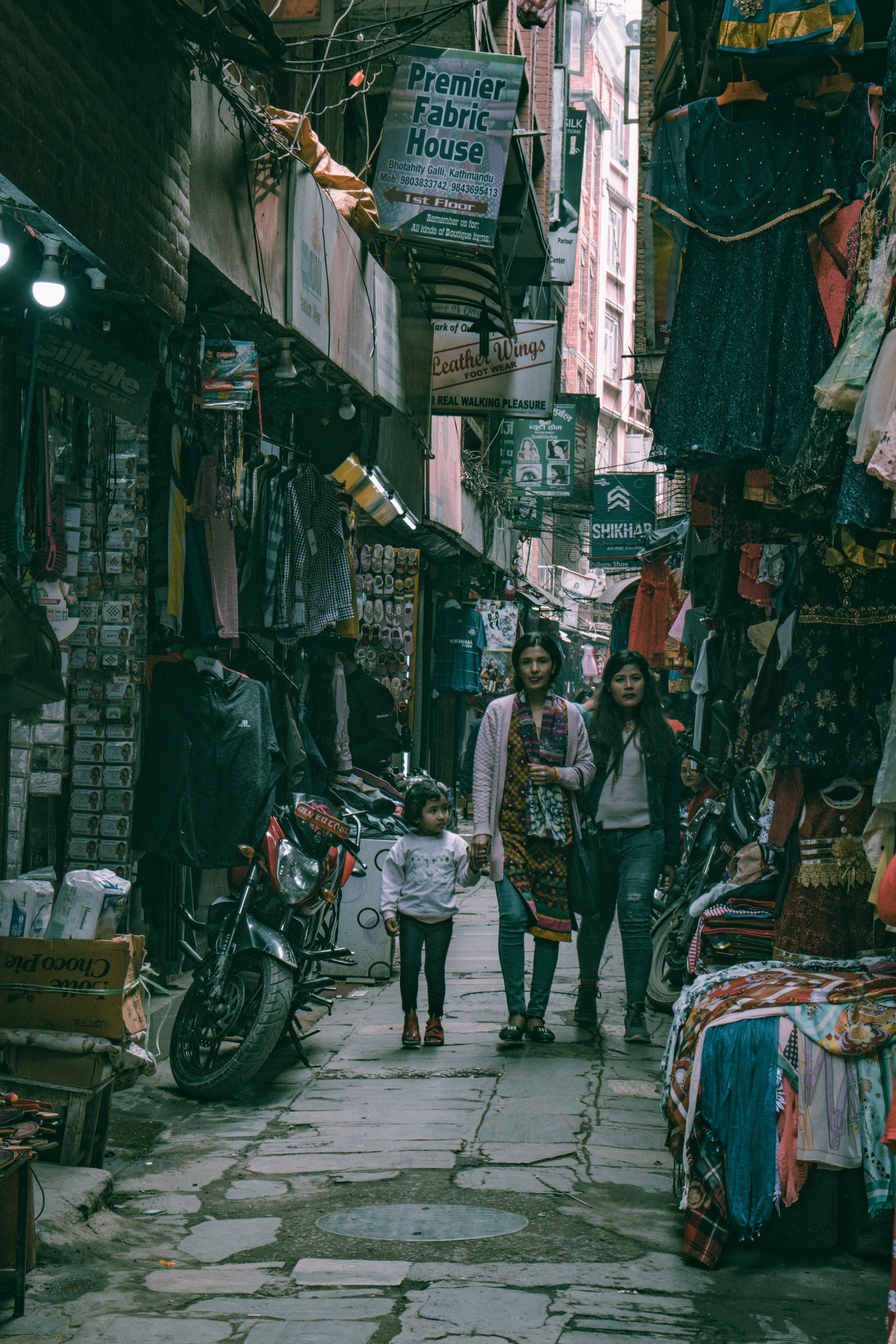 stalls, merchandise, mode of transportation, building exterior, retail, clothing, sale, street, motorcycle, pathway, wear, assorted, daylight, sell, shops, Phone HD Wallpaper