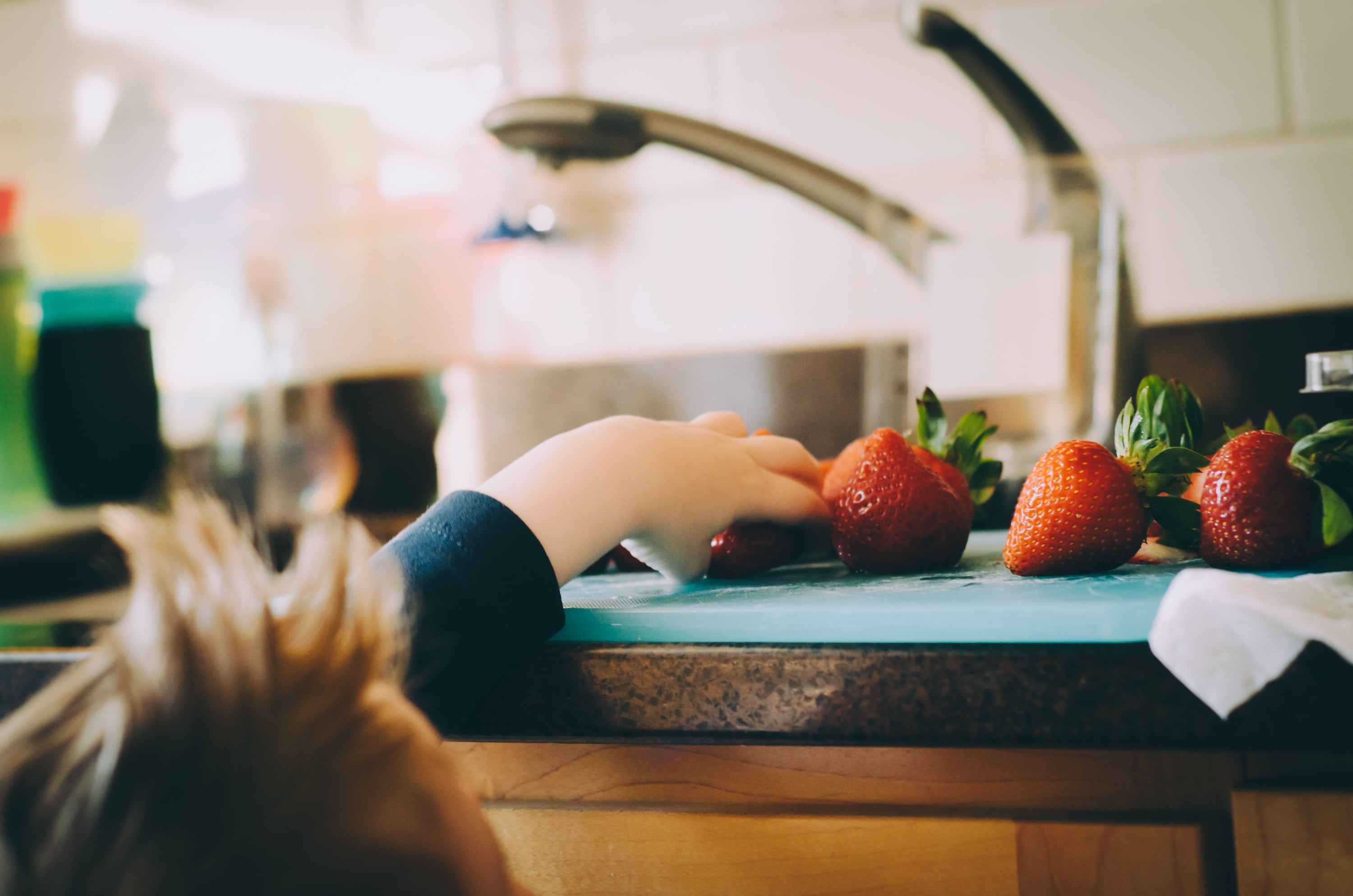 strawberry, 2K, human body part, child, kid, domestic room, real people, table, one person, healthy eating, sideboard, hand, kitchen, domestic kitchen, HD Wallpaper