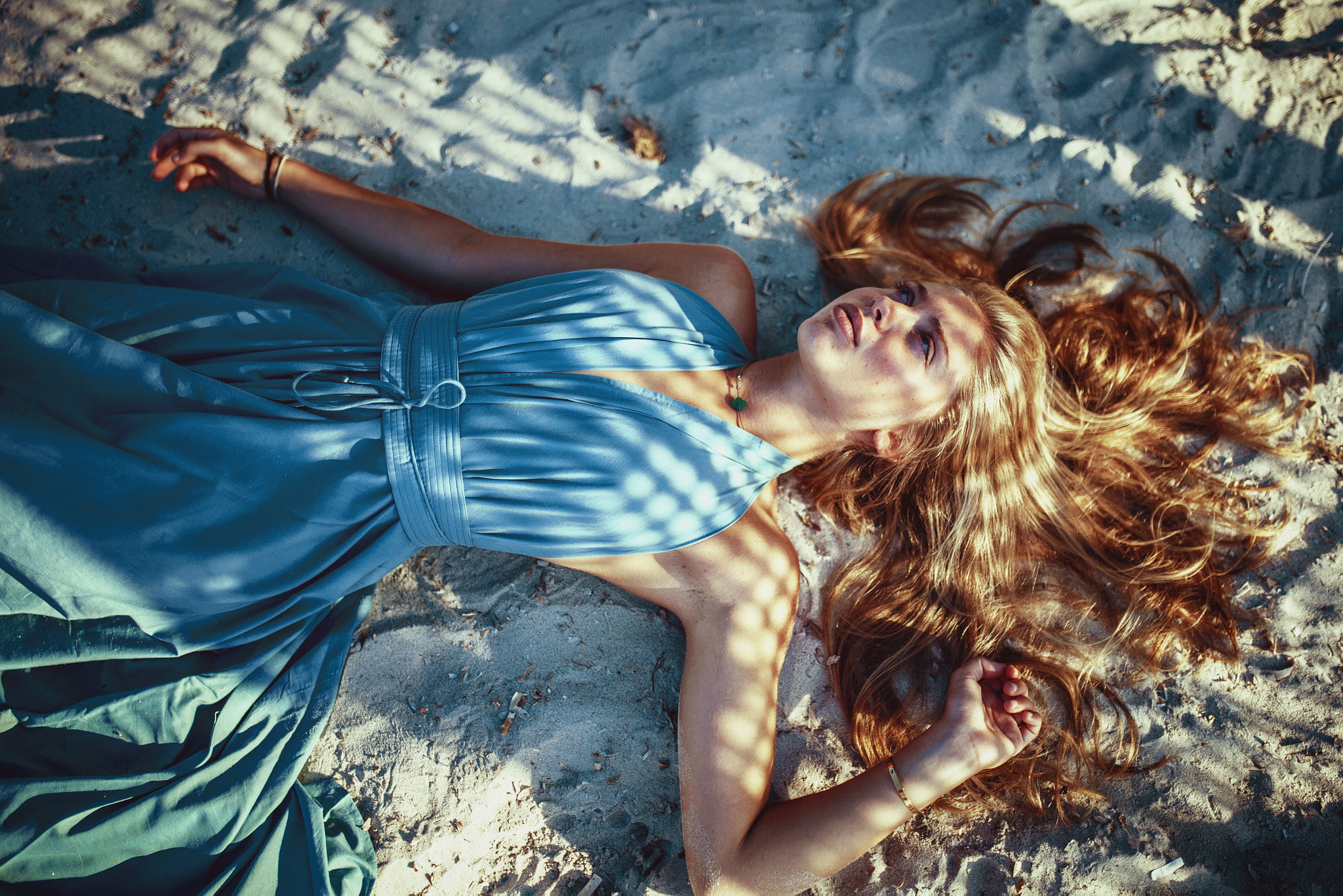 lifestyles, hair, young adult, leisure activity, long hair, Arnaud Moro, redhead, high angle view, sand, blue dress, beautiful woman, lying on back, lying down, HD Wallpaper