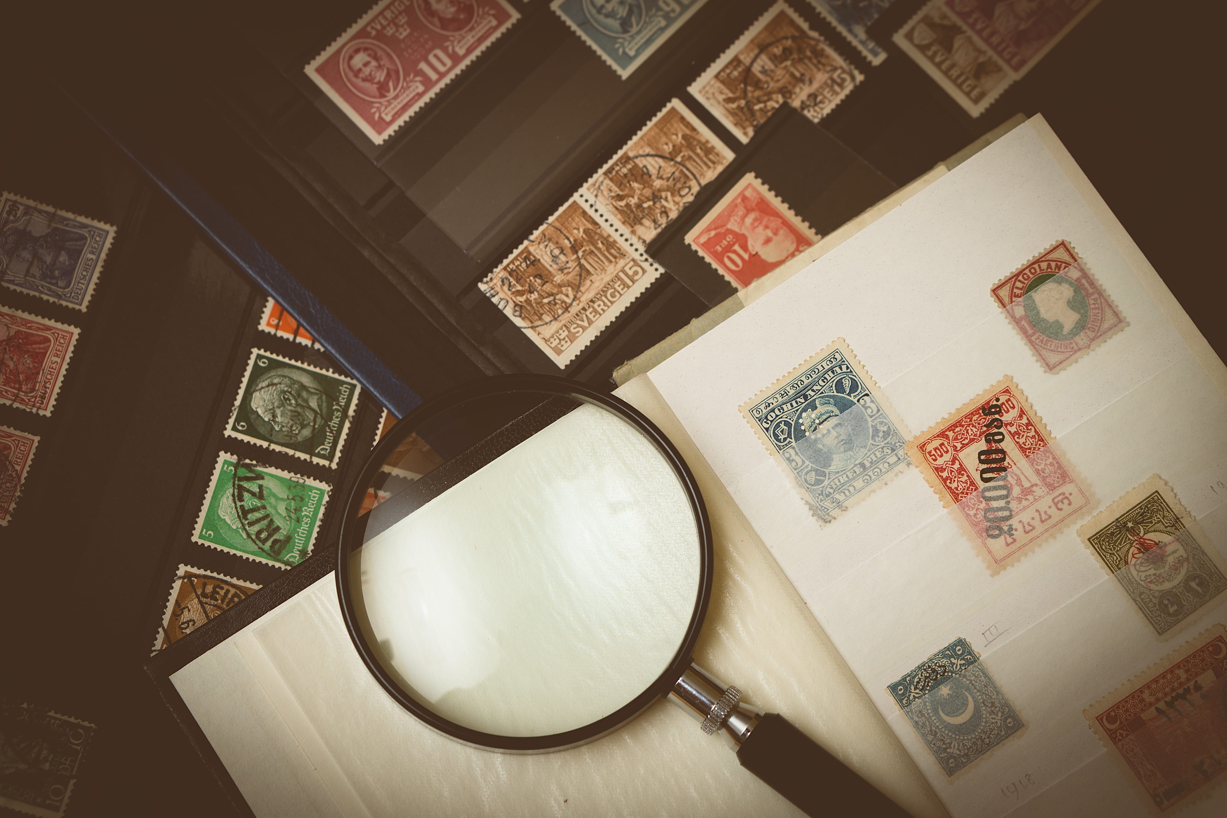 paper, communication, indoors, stamp, stamp collection, human representation, collection, close-up, magnifier, focus, old, table, the past, non-western script, HD Wallpaper