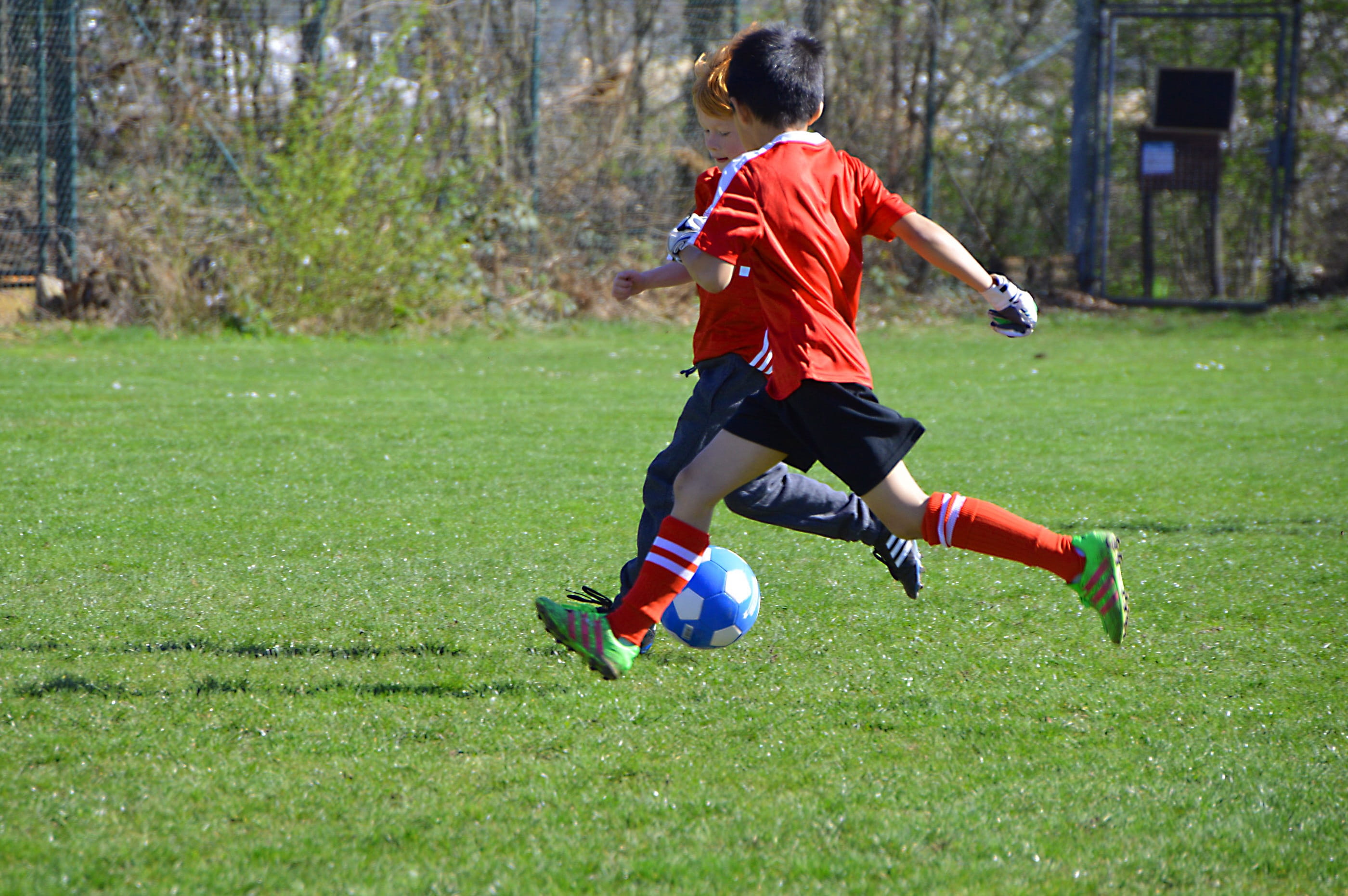 sun, green, child, striker, men, outdoors, child playing, rush, soccer, motion, two, sunny, ball, boy, real people, soccer ball, Children, play, rear view, HD Wallpaper