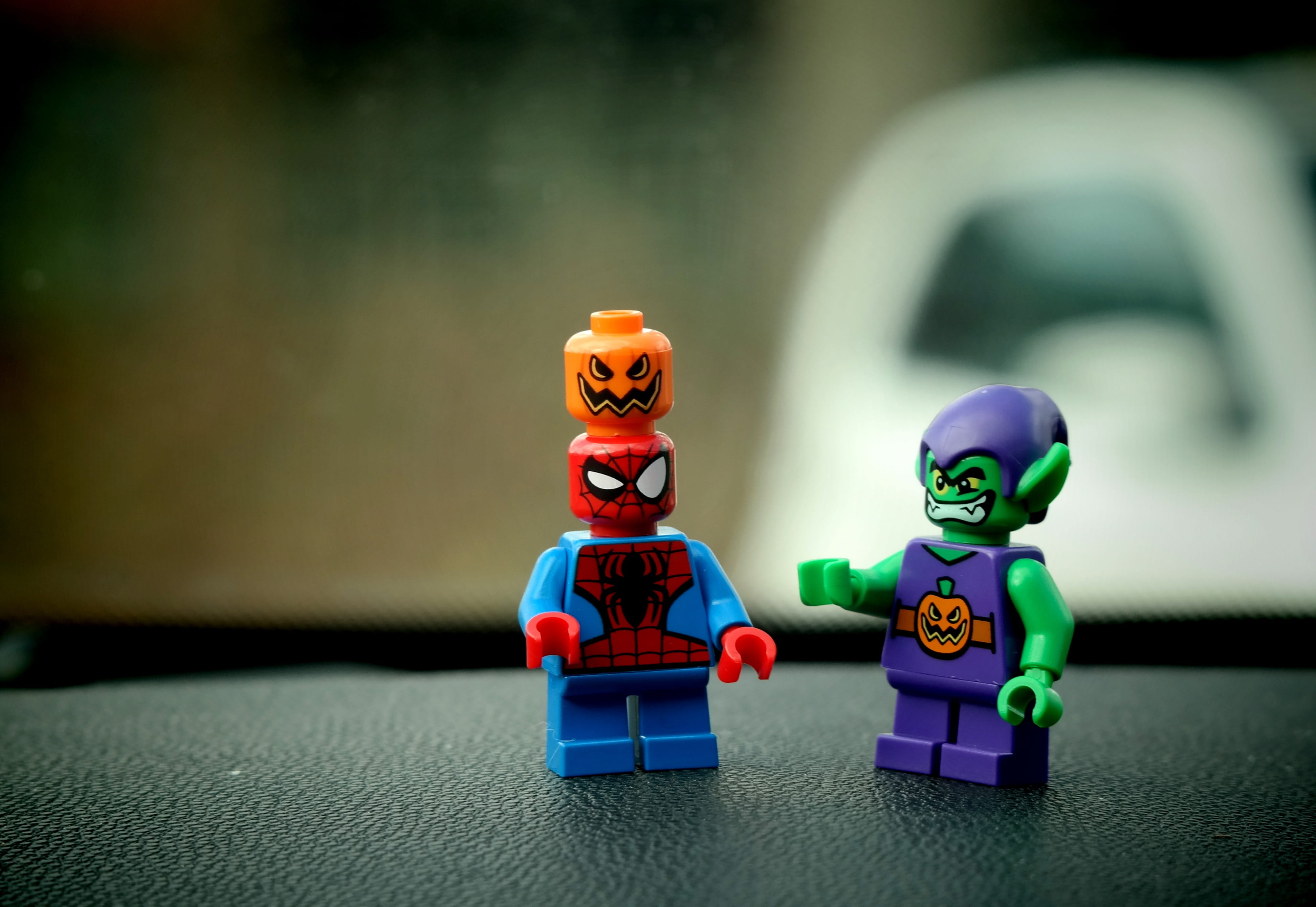 fun, Figures, childhood, Lego, male likeness, table, offspring, representation, Toys, human representation, robot, two objects, 4K, people, figurine, spiderman, HD Wallpaper