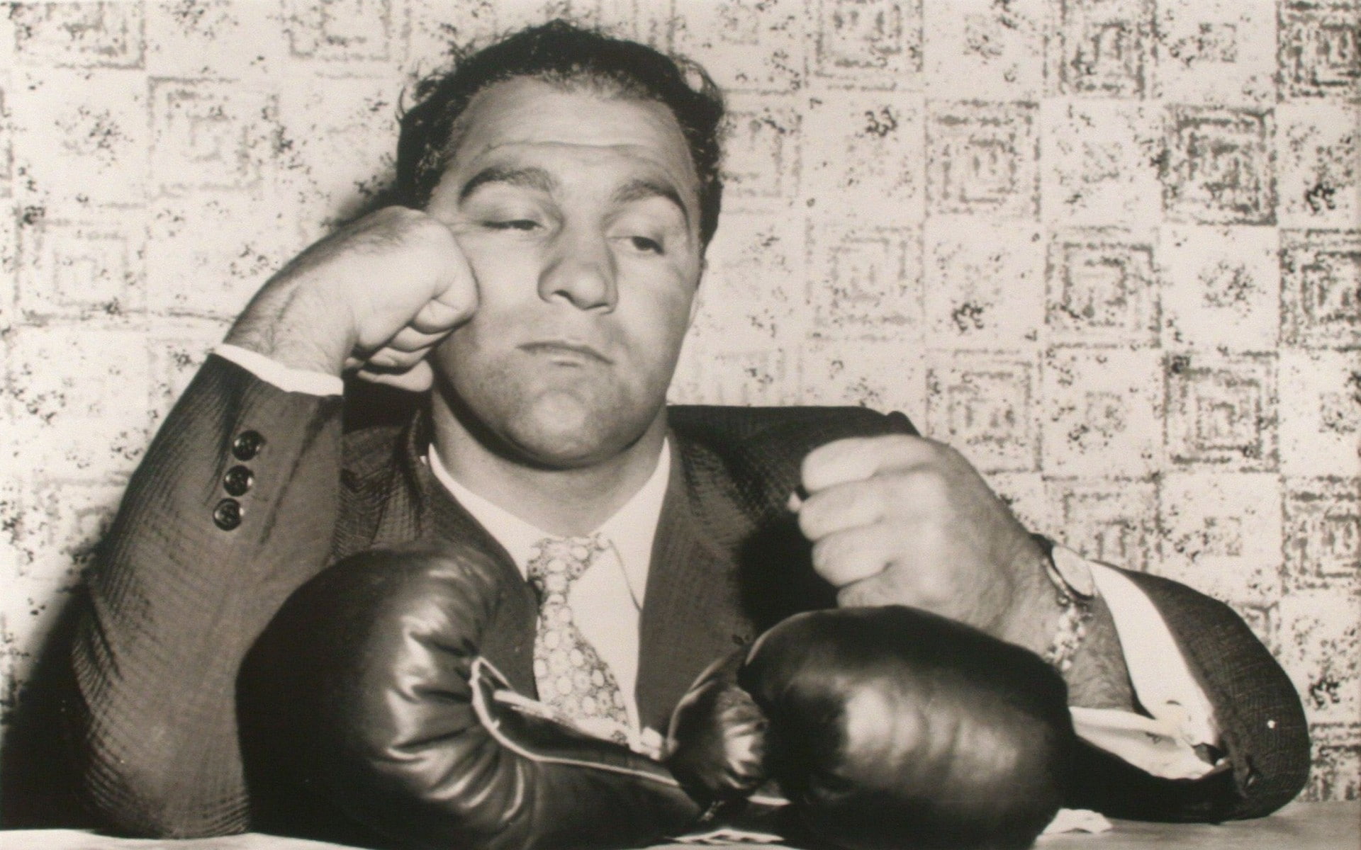 waist up, adult, sports, people, emotion, communication, front view, indoors, 1080P, sitting, Rocky Marciano, wall - building feature, boxing gloves, young adult, HD Wallpaper