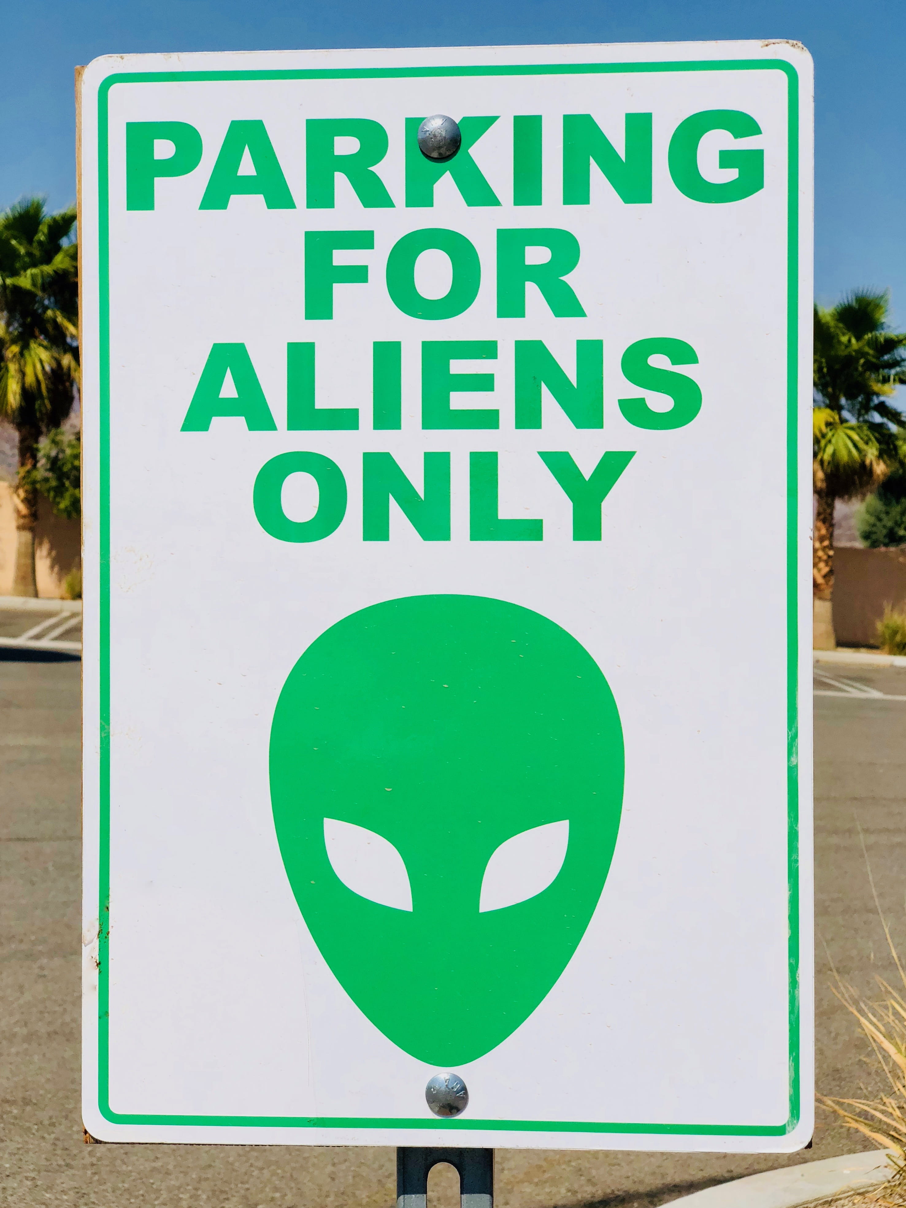 warning, photo, warning sign, no people, parking, symbol, signalise, daylight, message, circle, green color, text, day, outdoors, western script, road warning sign, Phone HD Wallpaper
