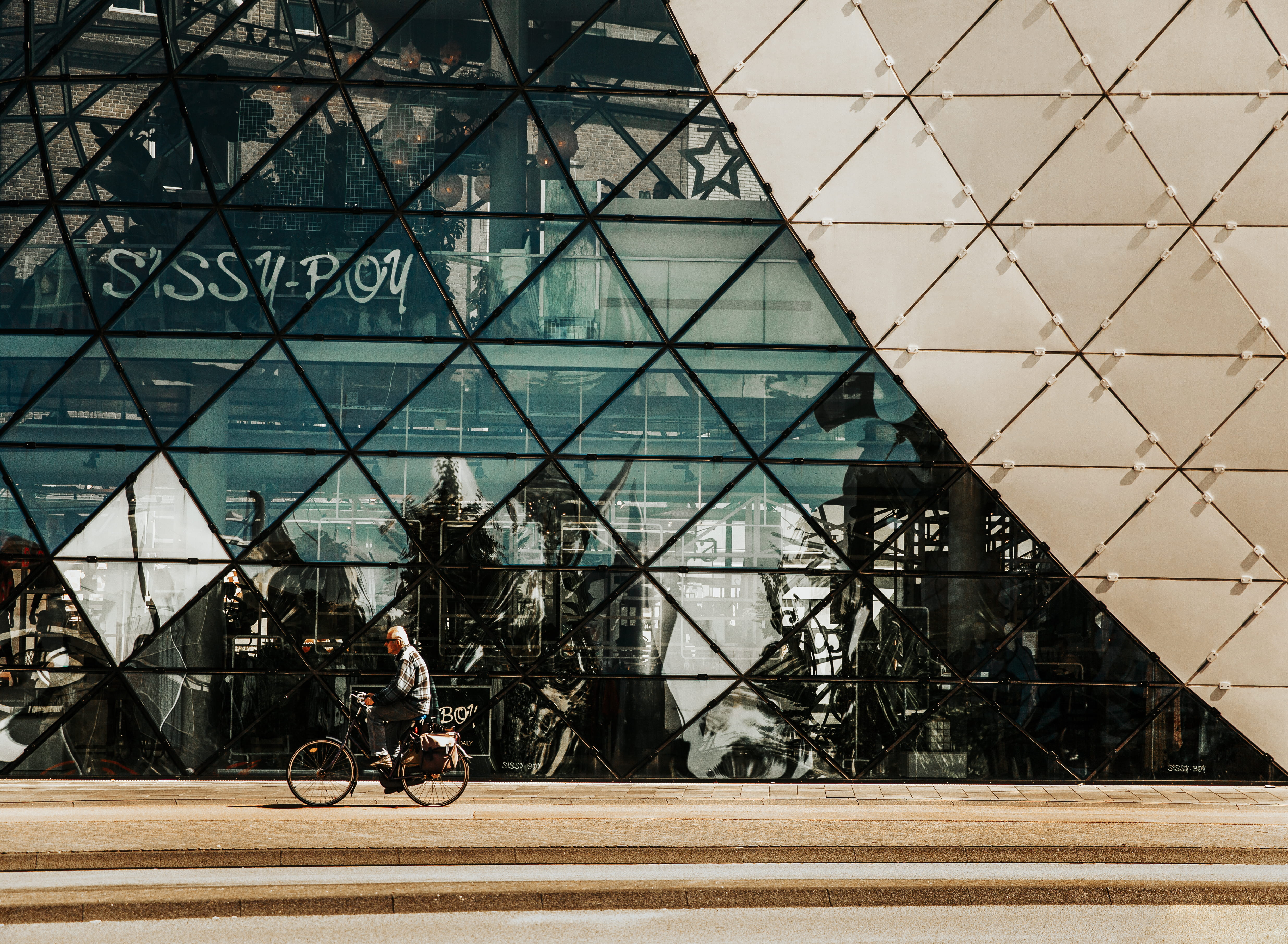 window, building exterior, person, bike, glass - material, 4K, transportation, outdoors, road, wall, wheel, vehicle, architecture, downtown, built structure, HD Wallpaper