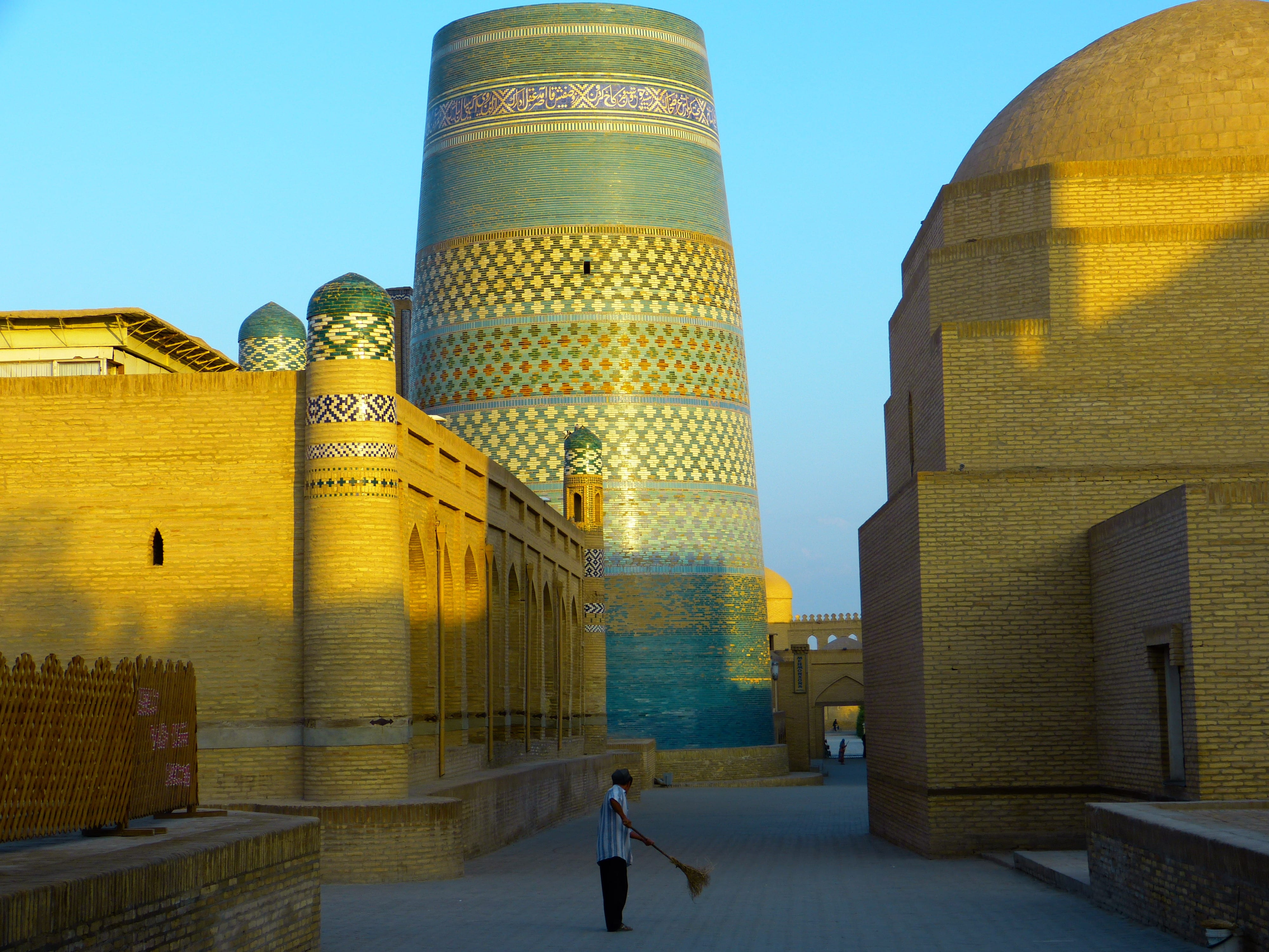 sweep, kalta minor, gold colored, city, khiva, one person, skyscraper, morning, building, tower, clear sky, street sweeper, dusk, office building exterior, HD Wallpaper
