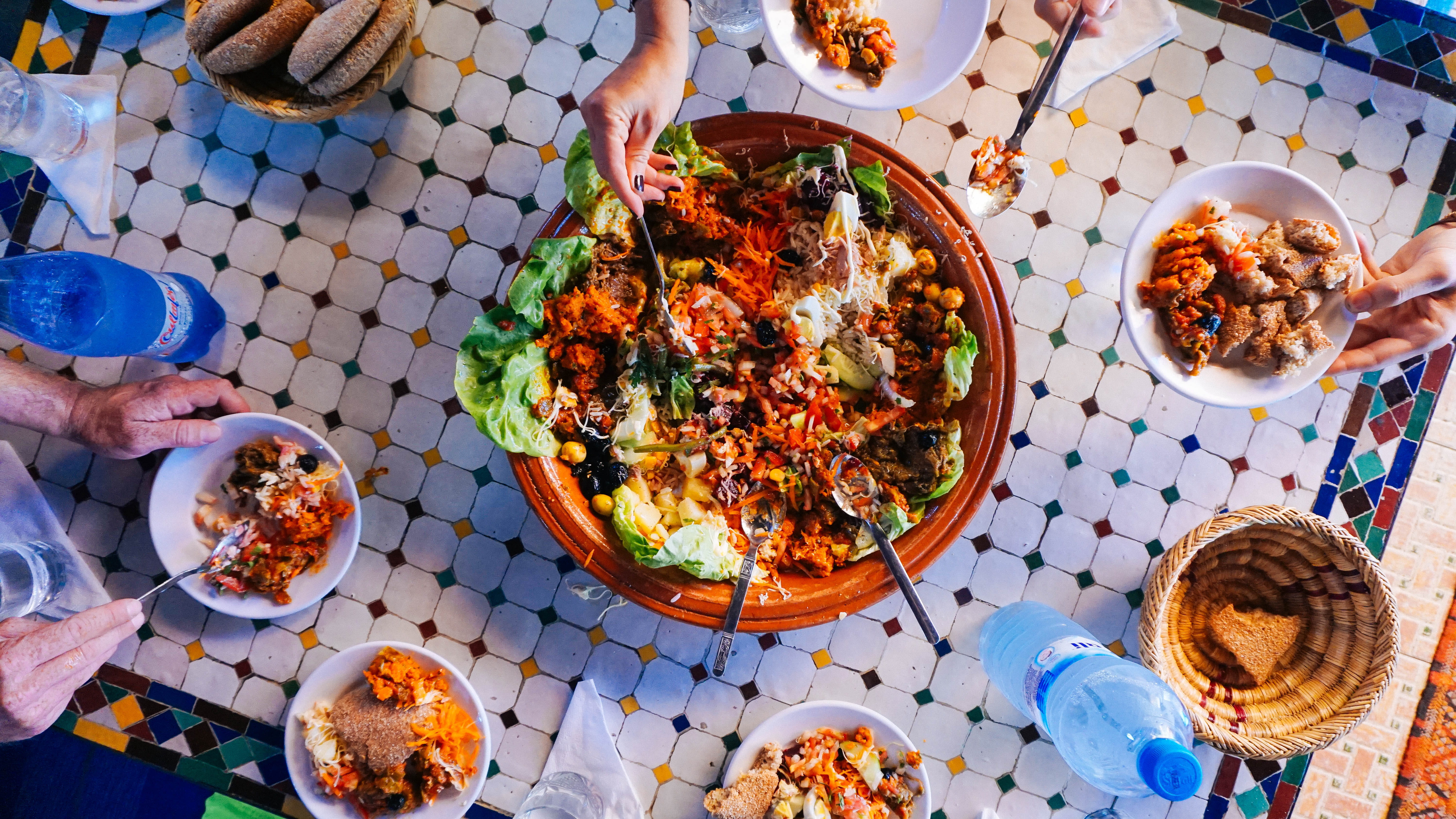 real people, family style, veggies, high angle view, unrecognizable person, pattern, bread, hands, lunch, freshness, tile, bowl, tiles, 5K, lettuce, food, HD Wallpaper