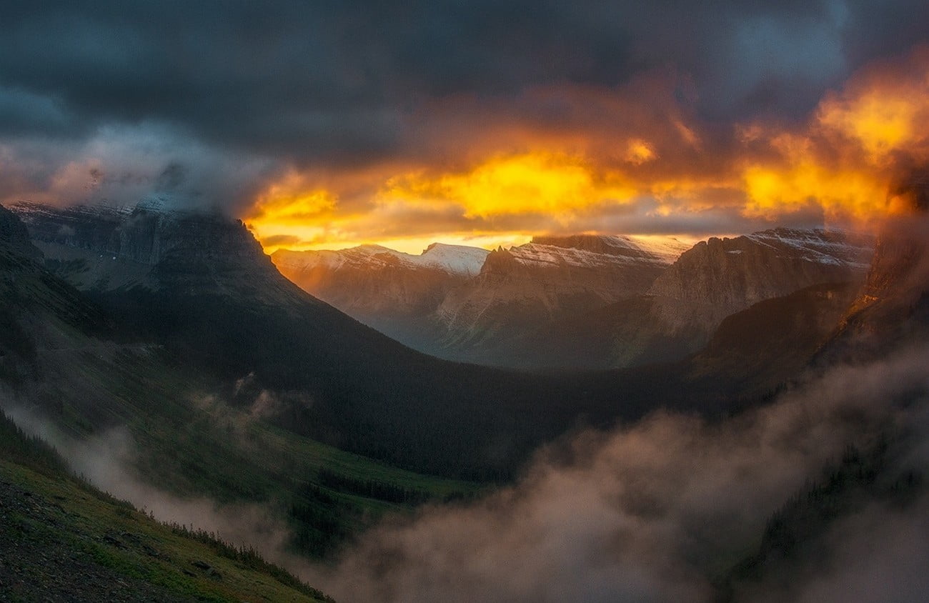 grass, forest, 720P, sunlight, nature, Glacier National Park, clouds, mist, mountain pass, mountain, landscape, sky, mountains, valley, snowy peak, HD Wallpaper