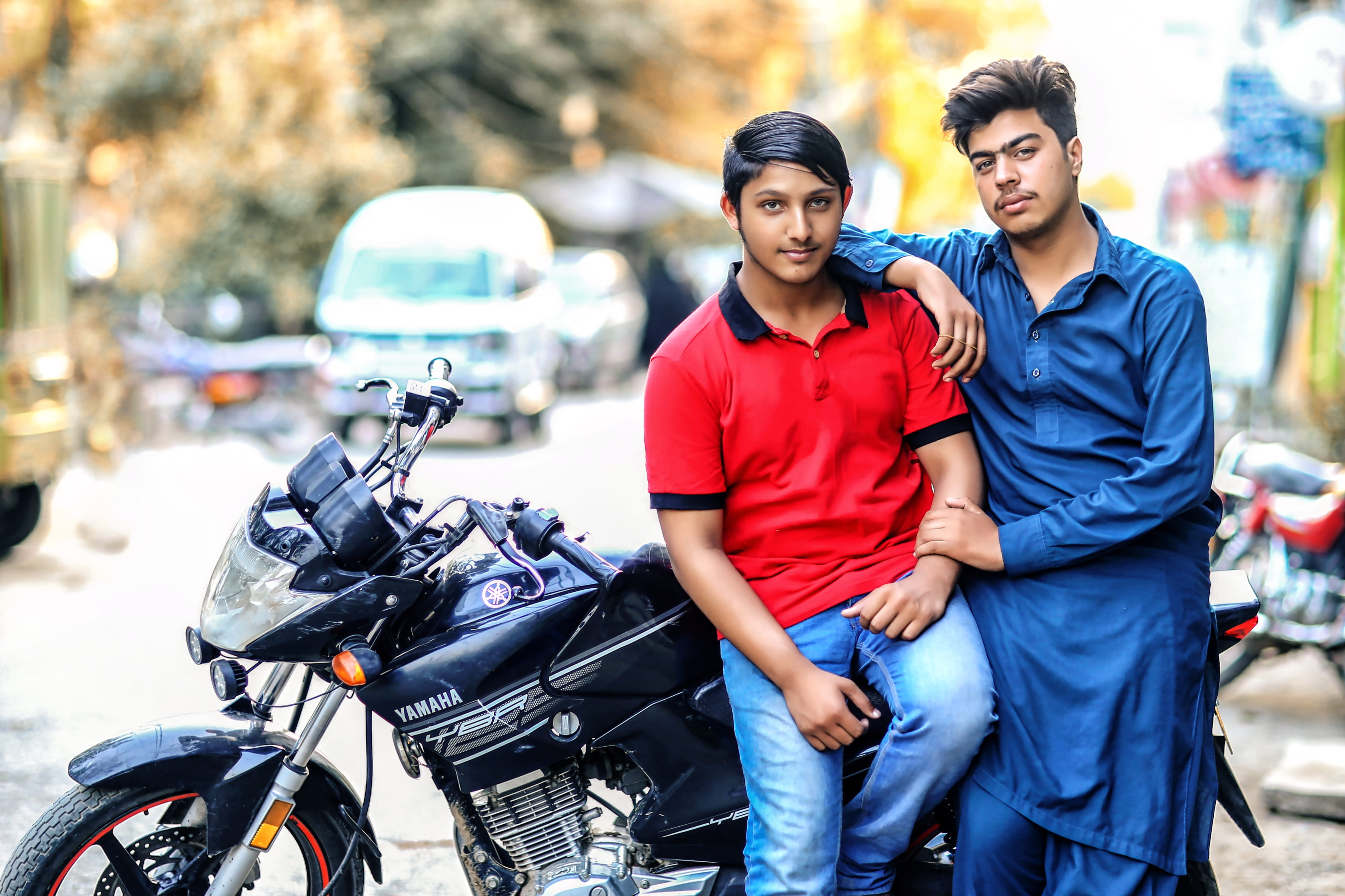 young men, golden sun, togetherness, casual clothing, two, transportation system, adult, blurred background, motorcycle, beautiful woman, pose, motorcycles, HD Wallpaper