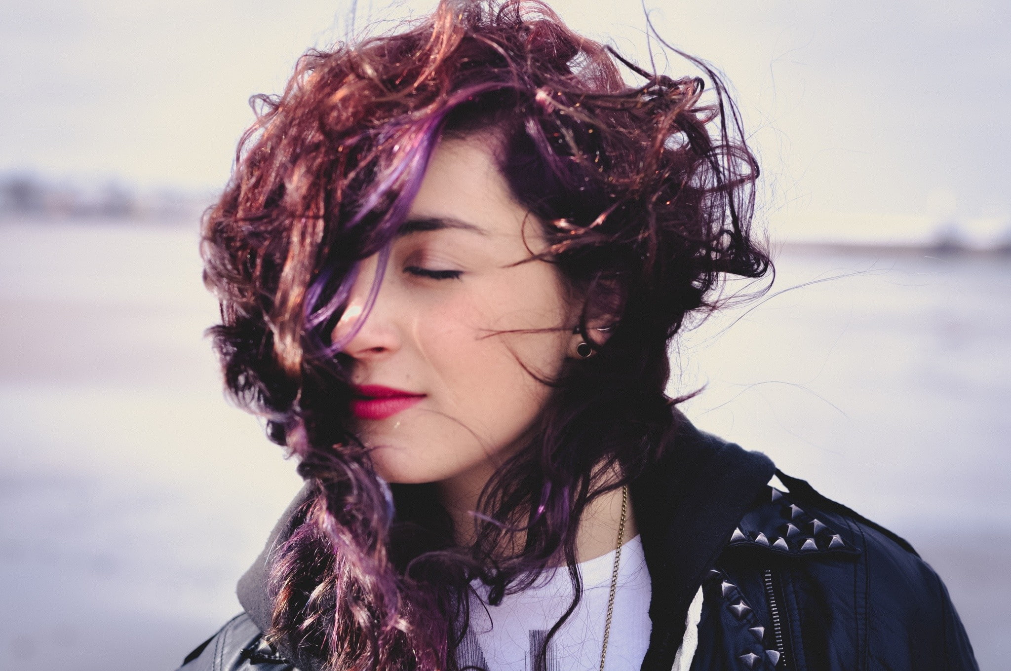women outdoors, windy, wavy hair, women, dyed hair, red lipstick, closed eyes, 1080P, leather jackets, HD Wallpaper
