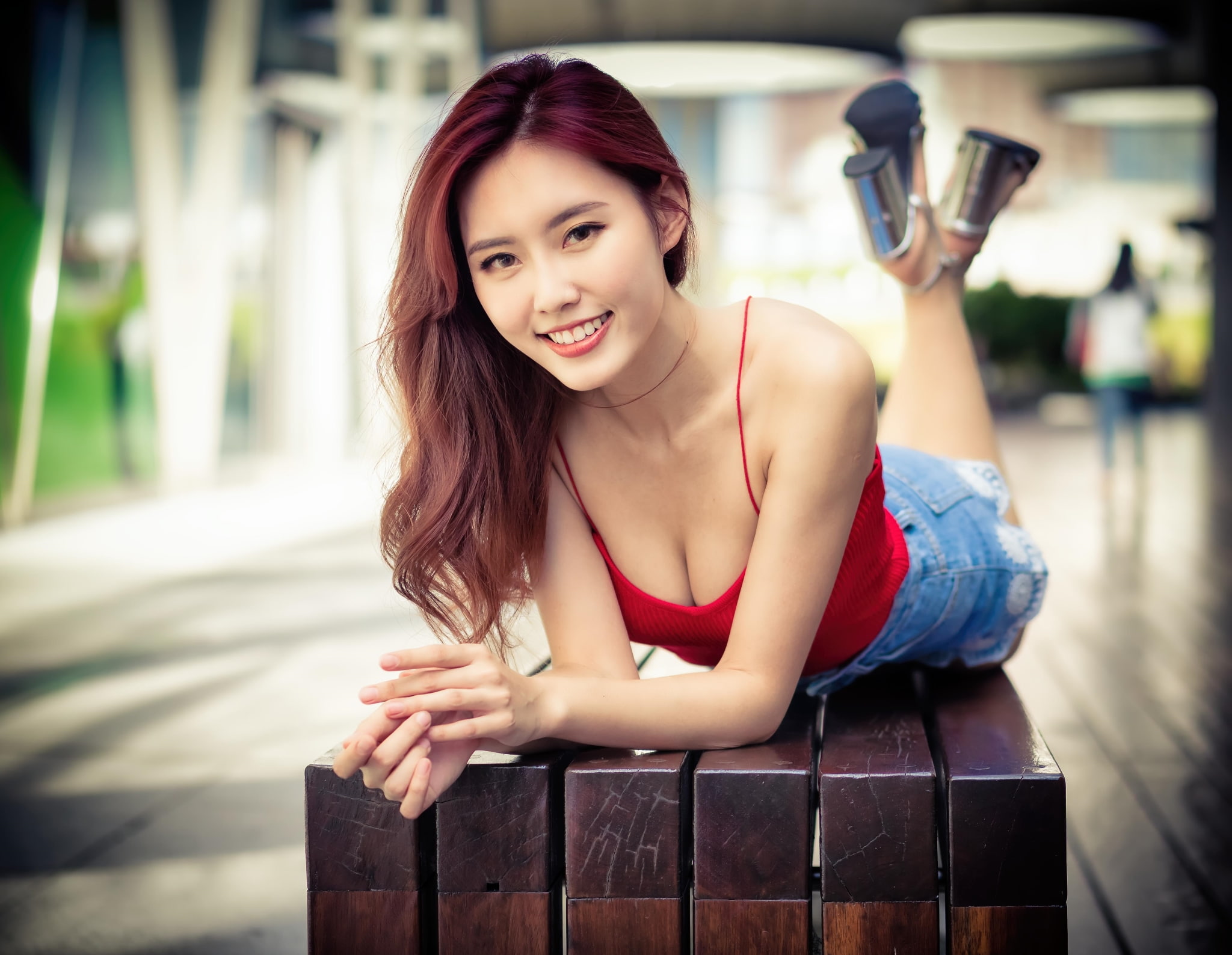 Asian, women outdoors, 1080P, bench, dyed hair, women, red tops, jean shorts, looking at viewer, depth of field, model, lying on front, smiling, HD Wallpaper