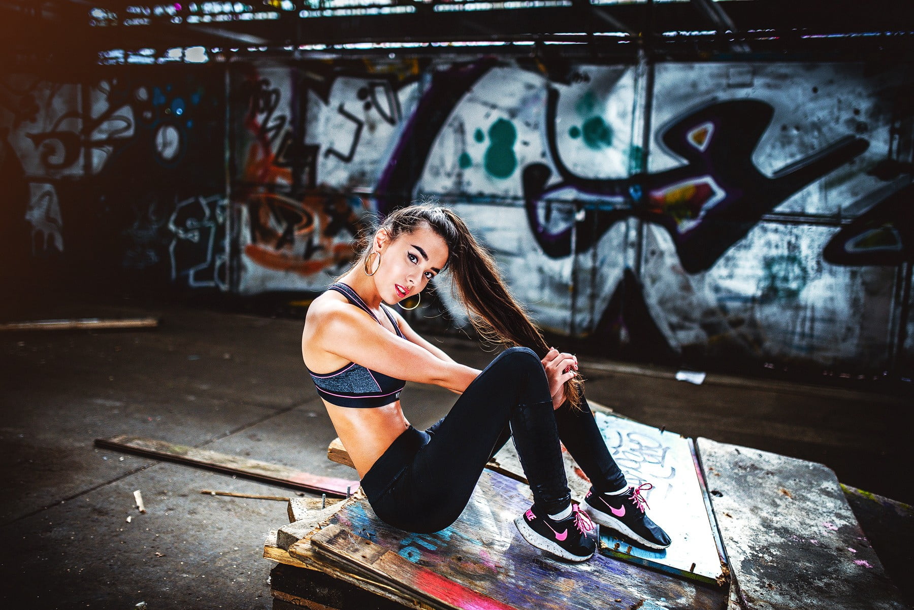 architecture, brunette, one person, young adult, young women, 720P, sitting, ponytail, clothing, gym clothes, hoop earrings, beautiful woman, sneakers, HD Wallpaper