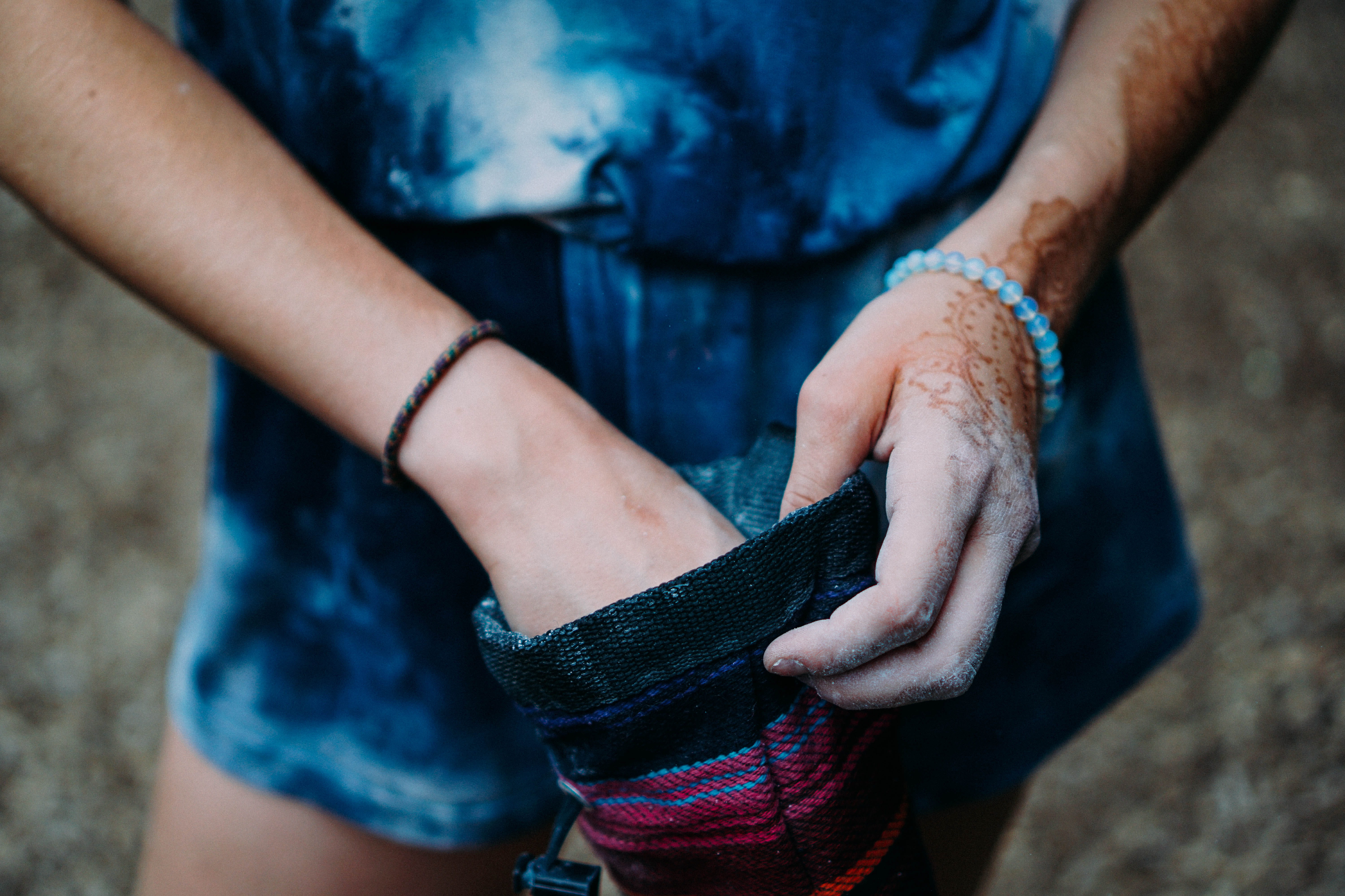 person, 5K, blue, body part, focus on foreground, human limb, denim shorts, red, pouch, hand, holding, lifestyles, wearing, close, photography, one Person, HD Wallpaper