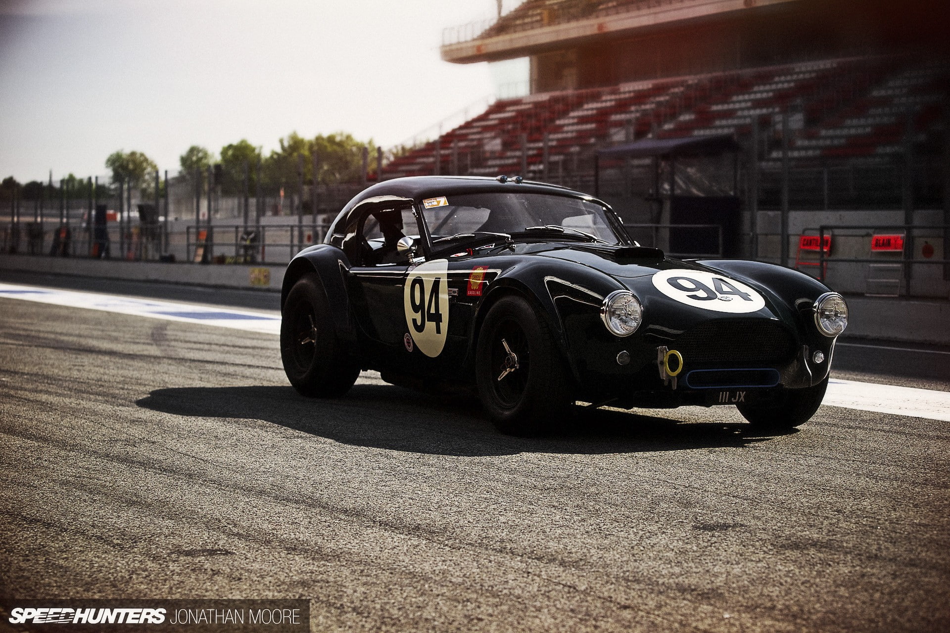 city, sunlight, tire, car, mode of transportation, road, transportation, architecture, outdoors, street, motor racing track, no people, black cars, wheel, HD Wallpaper