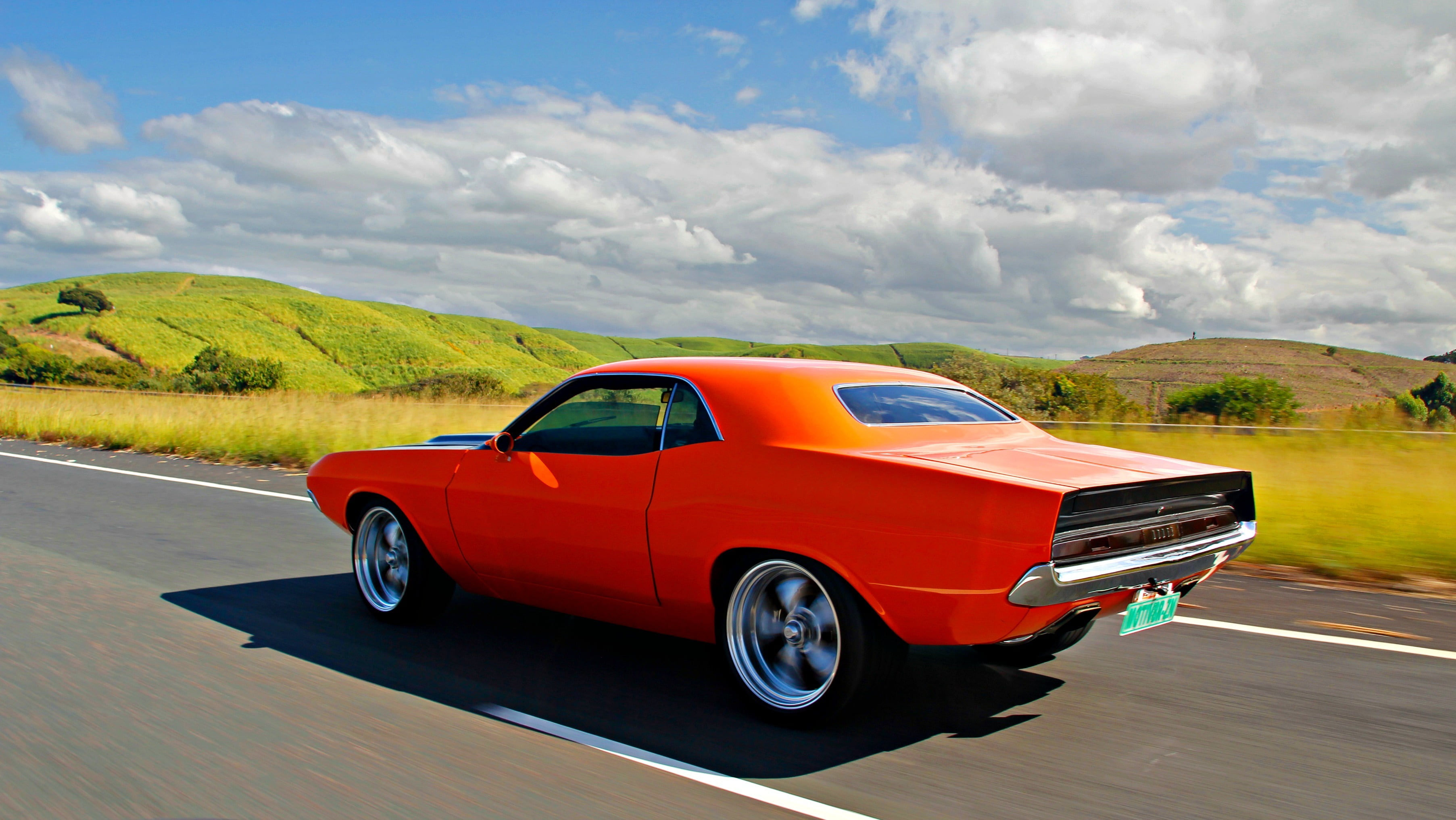 sky, driving, landscape, outdoors, orange, coupe, sunlight, 2K, motor vehicle, rollin, road trip, motion, muscle, cloud - sky, sunny, clouds, luxury, nature, HD Wallpaper