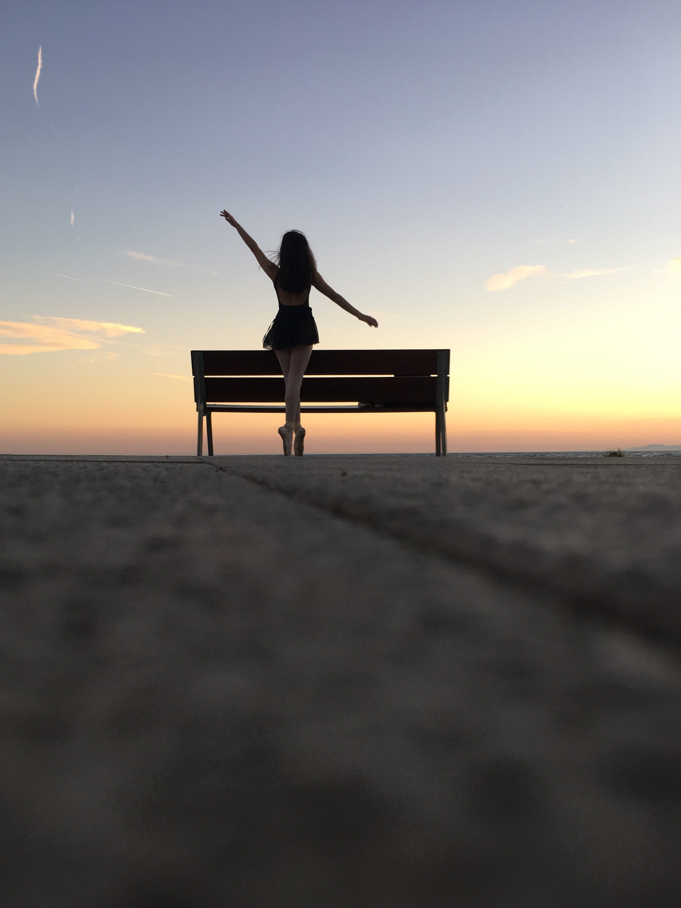 hardwood, real people, sunlight, leisure activity, woman, table, one person, sitting, park bench, furniture, beach, water, person, outdoors, 2K, photography, Phone HD Wallpaper