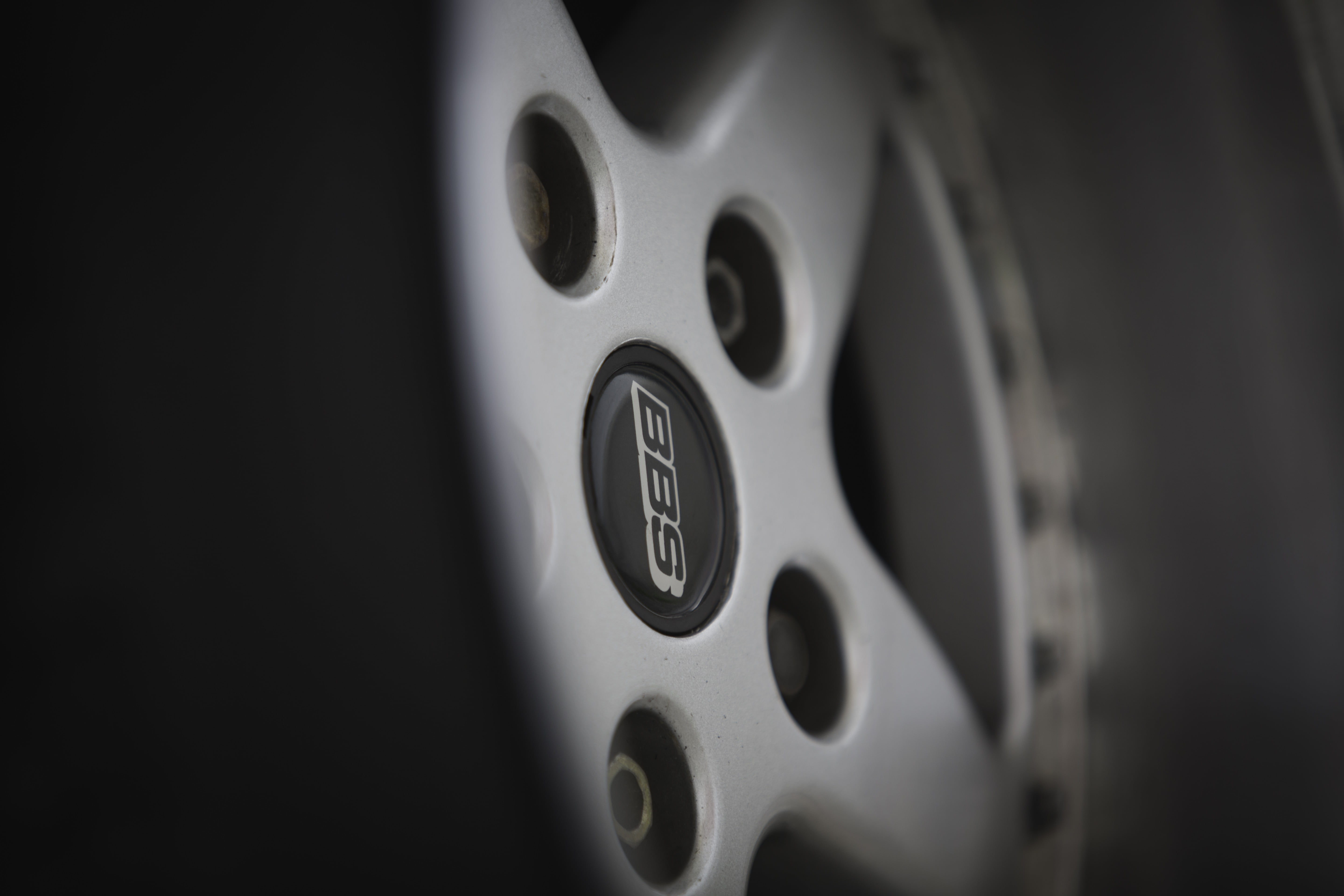 black color, automotive, BBS, indoors, copy space, studio shot, circle, equipment, car interior, full frame, design, close-up, black background, 5K, gray, HD Wallpaper
