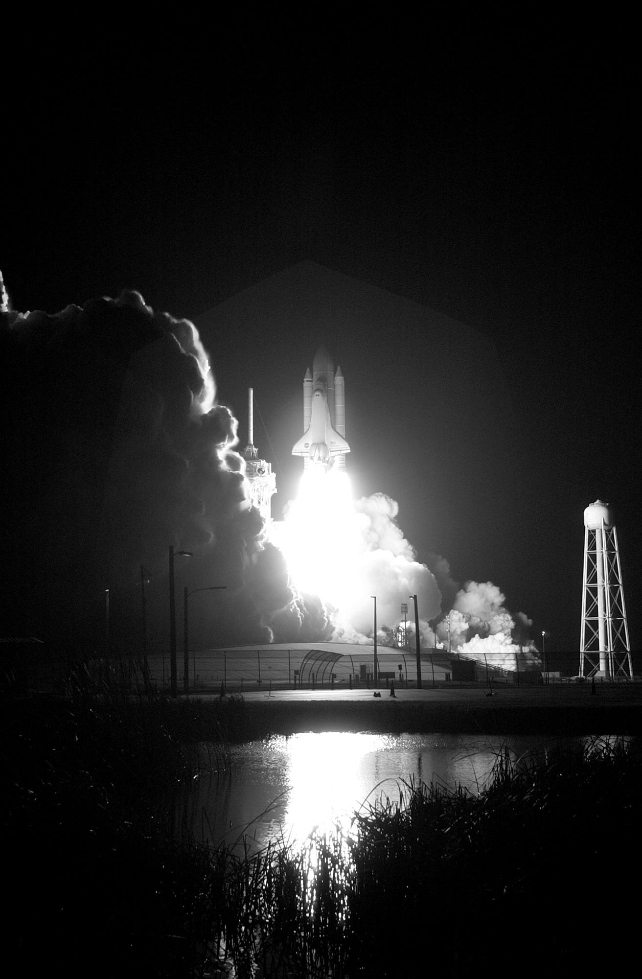 air pollution, orbit, grayscale, night, building exterior, blast off, river, bright, architecture, power, spacecraft, smoke, bridge, photo, tree, connection, Phone HD Wallpaper