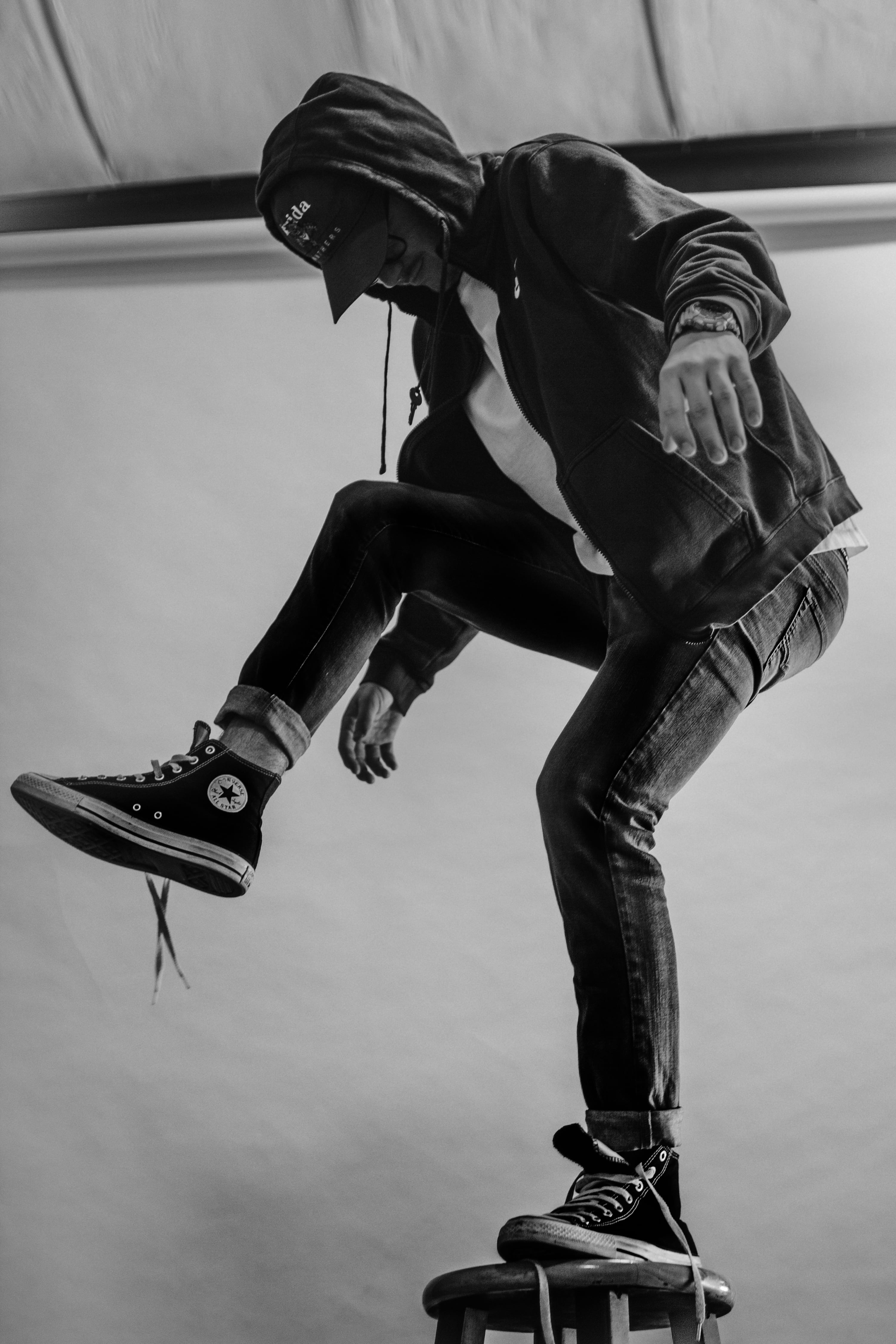 shoe, grayscale, jumping, man, indoors, skill, sports equipment, casual clothing, standing, one person, mid-air, lifestyles, balance, boy, real people, Phone HD Wallpaper