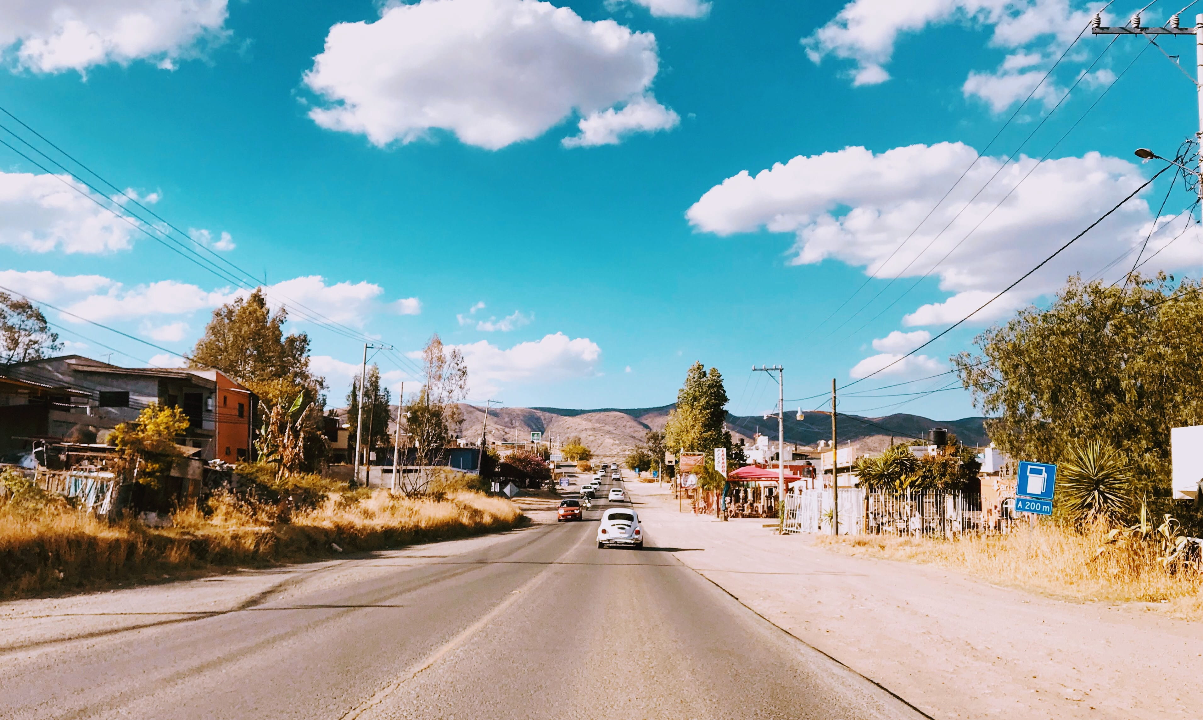 outdoors, cloud, street, diminishing perspective, straight, hills, building exterior, mode of transportation, wires, transportation, city, land vehicle, HD Wallpaper