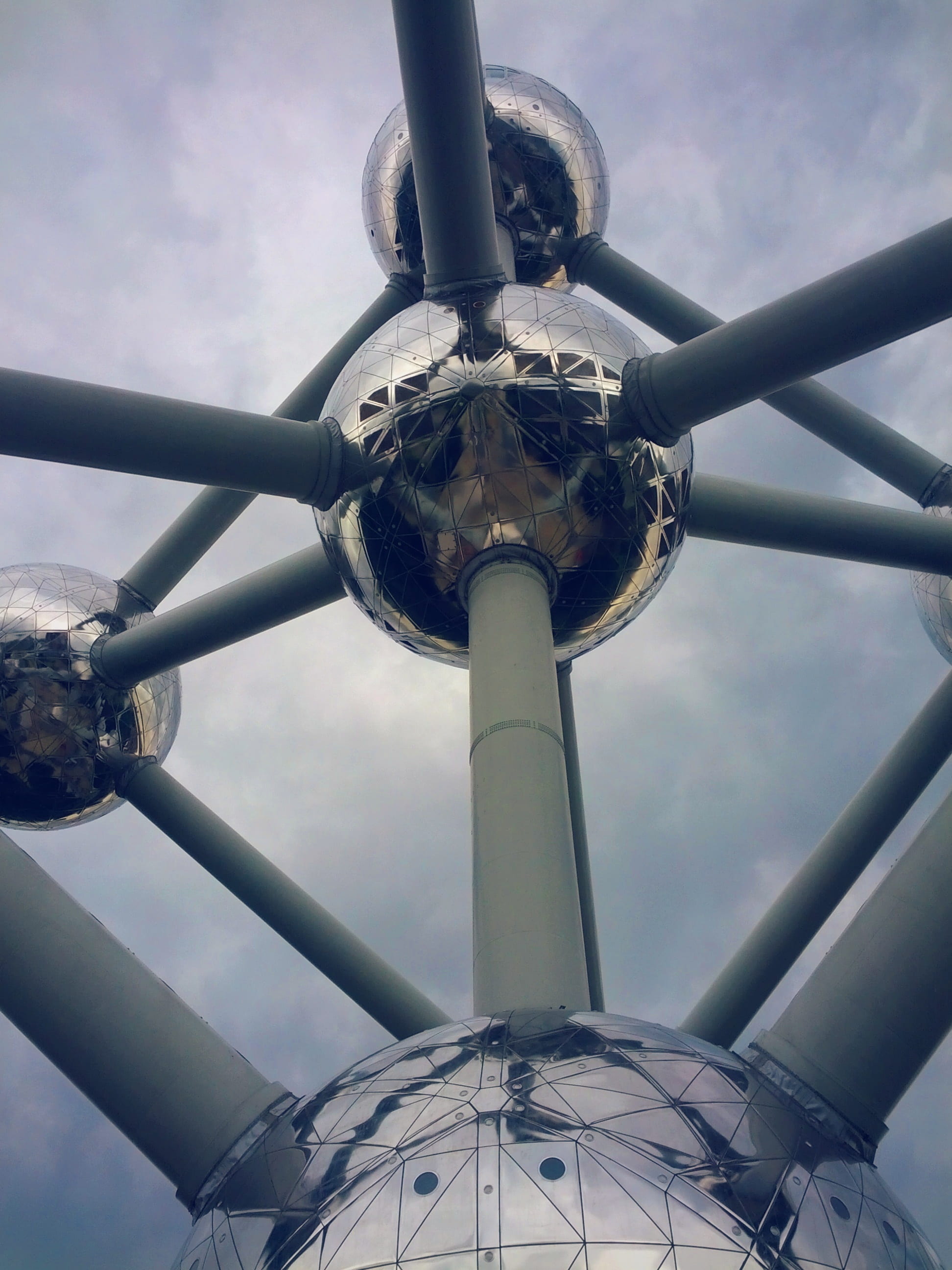 amusement park, building, city, silver colored, outdoors, travel, belgian, atomium, air vehicle, exhibition, nature, tall - high, cloud, built structure, Phone HD Wallpaper