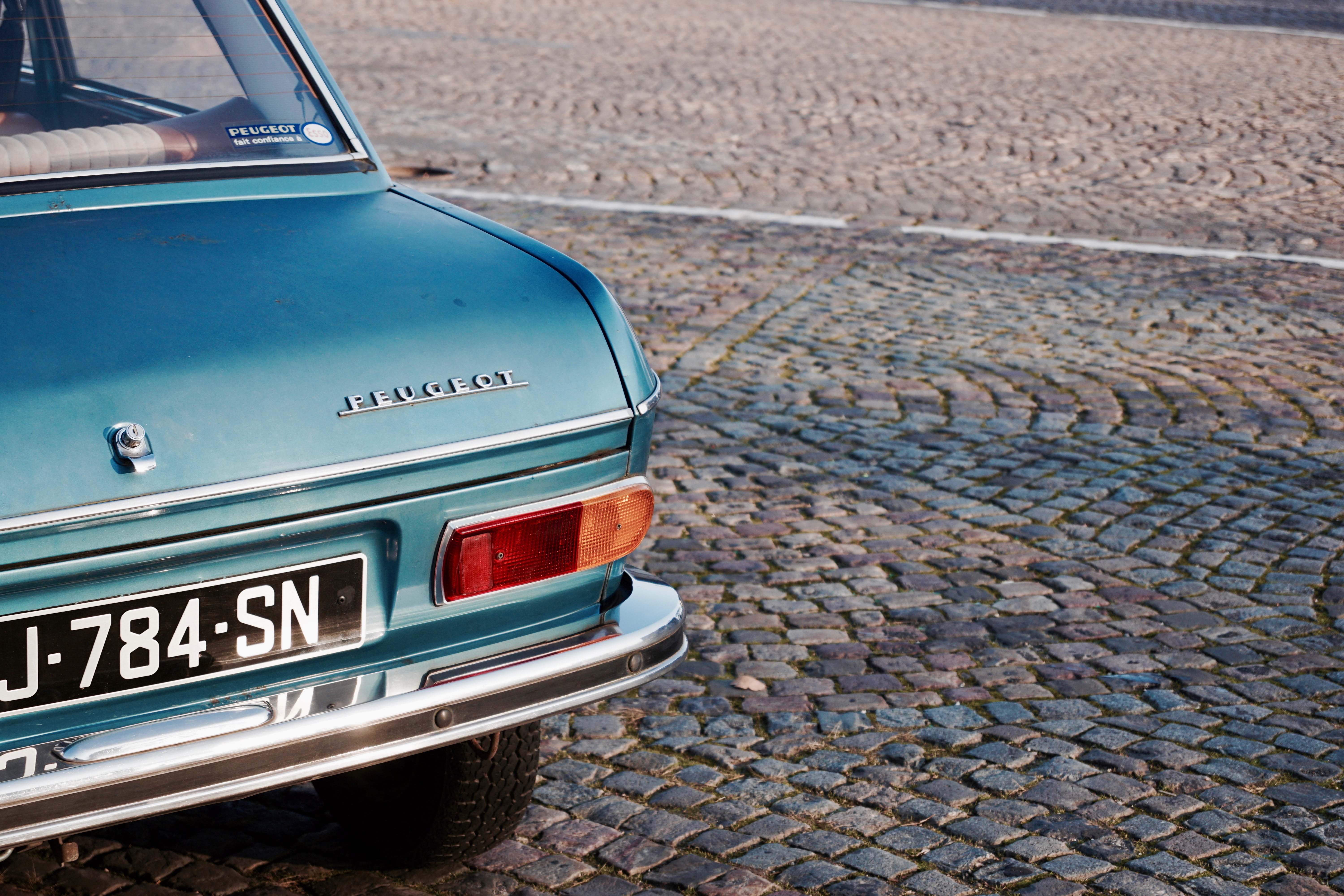 motor vehicle, classic, 5K, brown, retro, high angle view, text, street, road, bumper, Peugeot, retro Styled, green, day, concrete, paving stone, city, HD Wallpaper