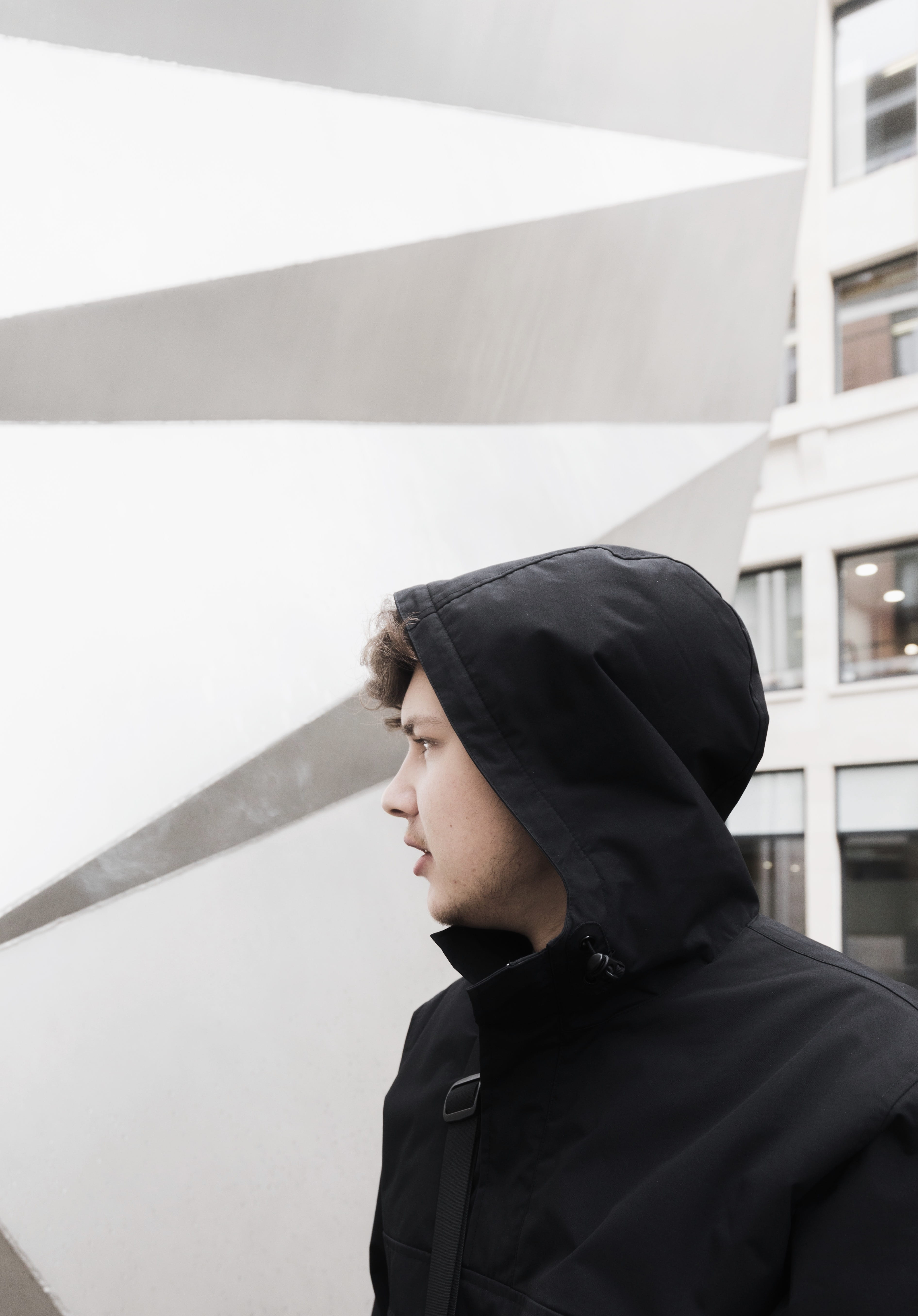 headshot, hood - clothing, time, side view, black, street wear, near, architecture, cold, day, wall, leisure activity, 5K, daytime, young adult, male, Phone HD Wallpaper