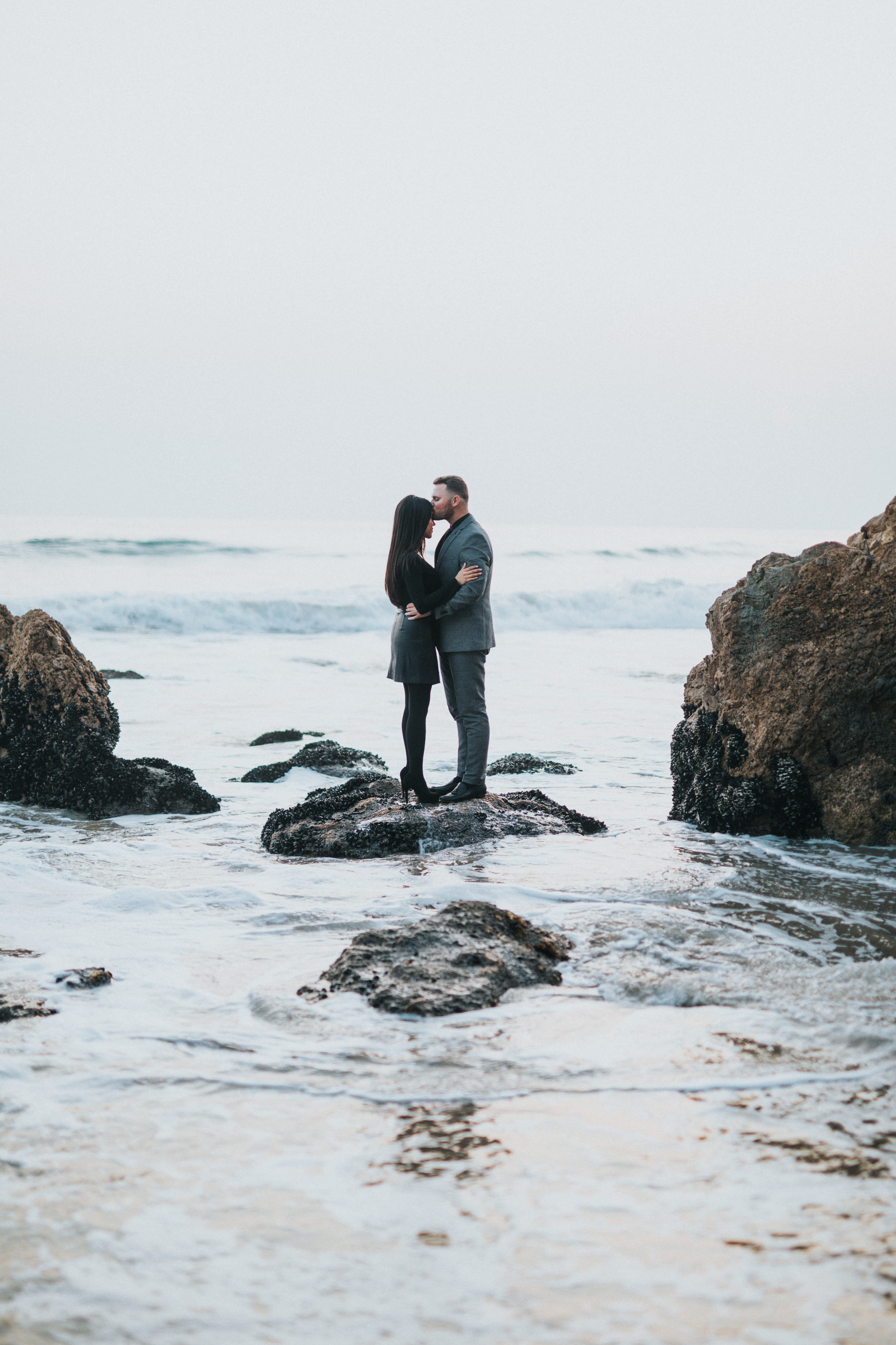 beach, outdoors, daytime, body, kissing, sleeved, full length, formal, long, day, rock - object, solid, real people, sea, woman, water, 5K, males, rock, Phone HD Wallpaper