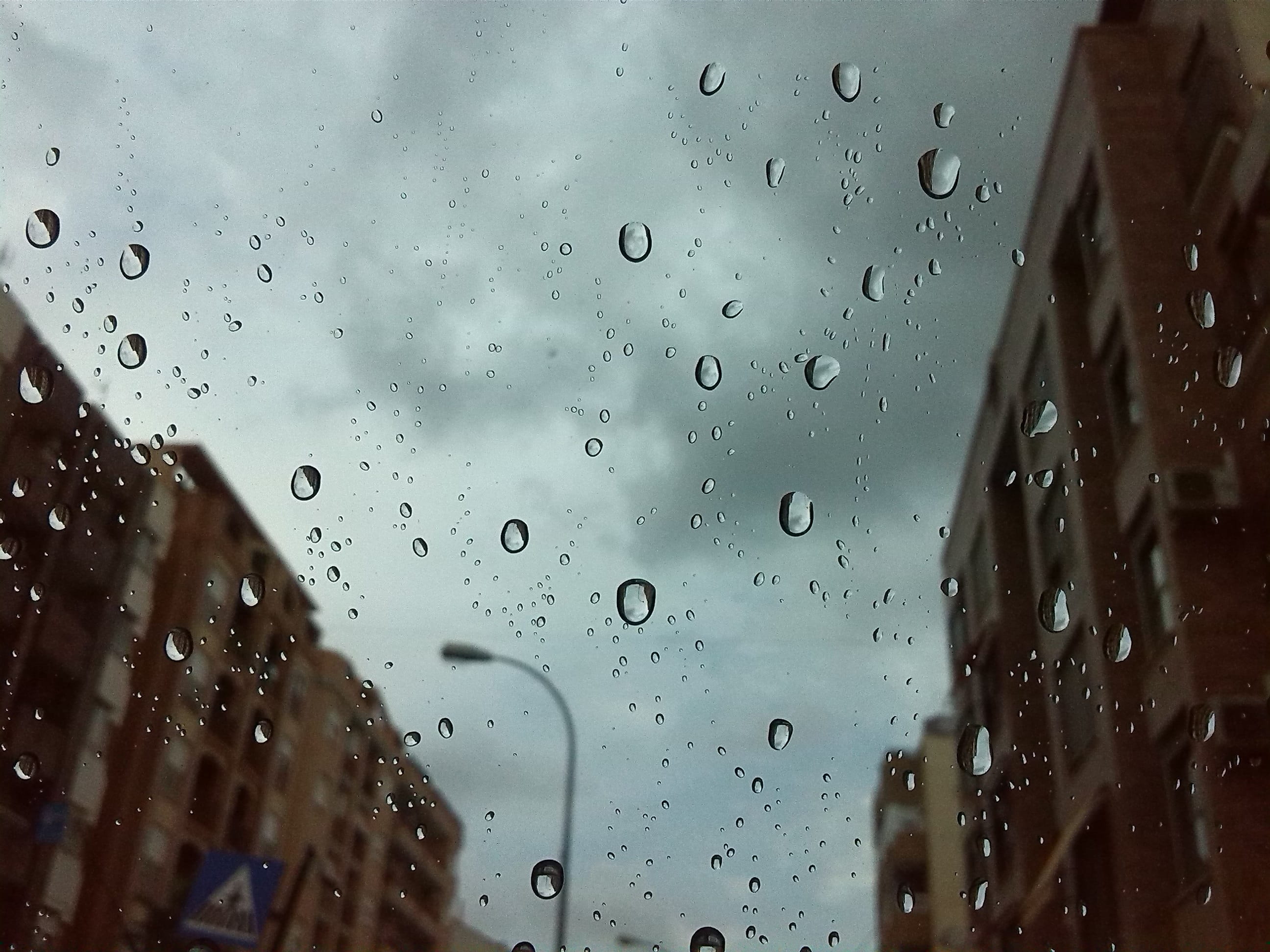 window, drop, close-up, focus on foreground, city, raindrop, sky, transparent, no people, streets, wet, nature, glass, architecture, water, glass - material, HD Wallpaper