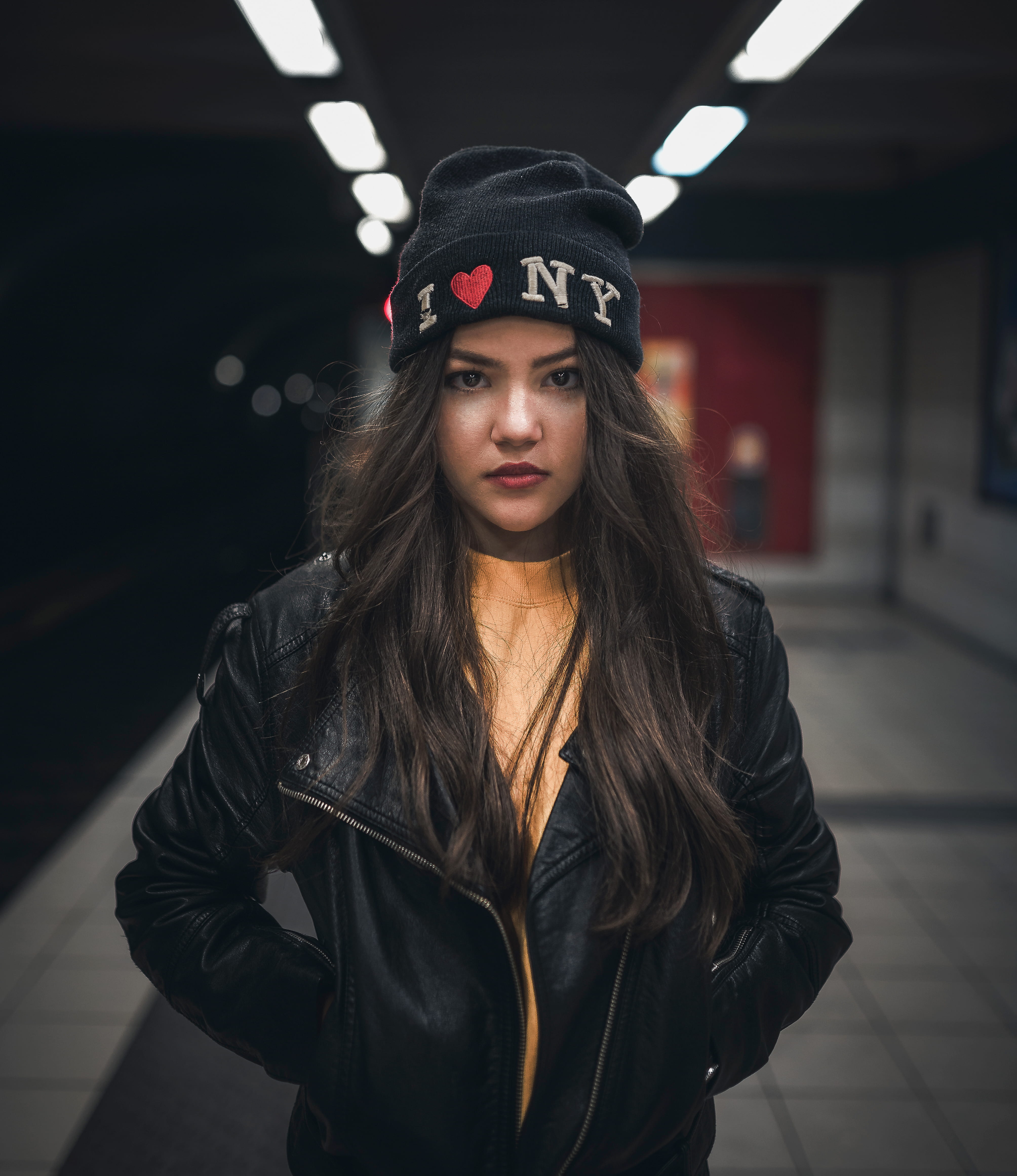 underground, fashion, young adult, serious, hairstyle, long hair, standing, style, hair, front view, headshot, ny, subway, person, platform, stern, looking at camera, Phone HD Wallpaper
