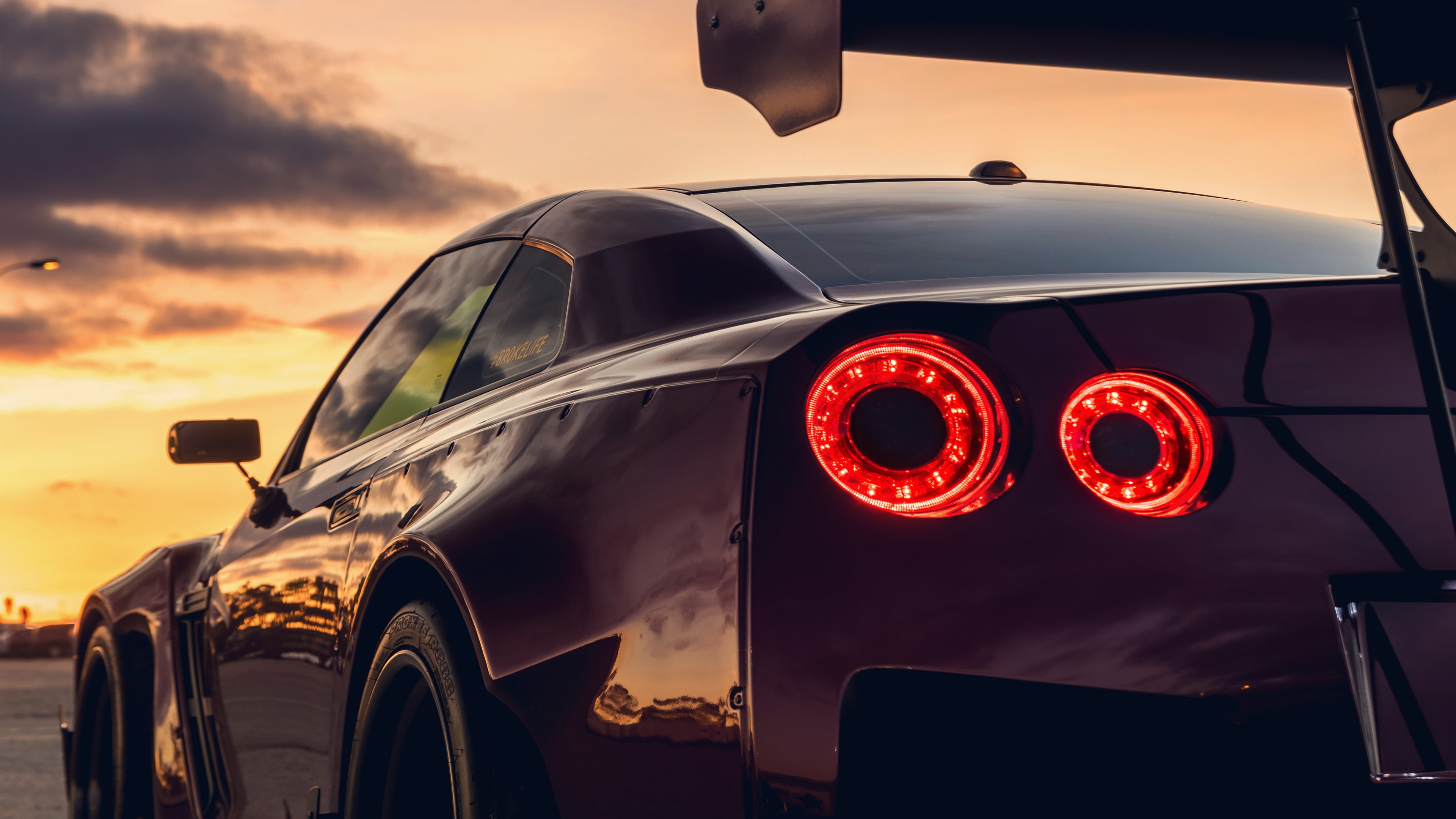 nissan gt r, car, sky, sports car, nissan, automotive lighting, 4K, vehicle, black car, HD Wallpaper