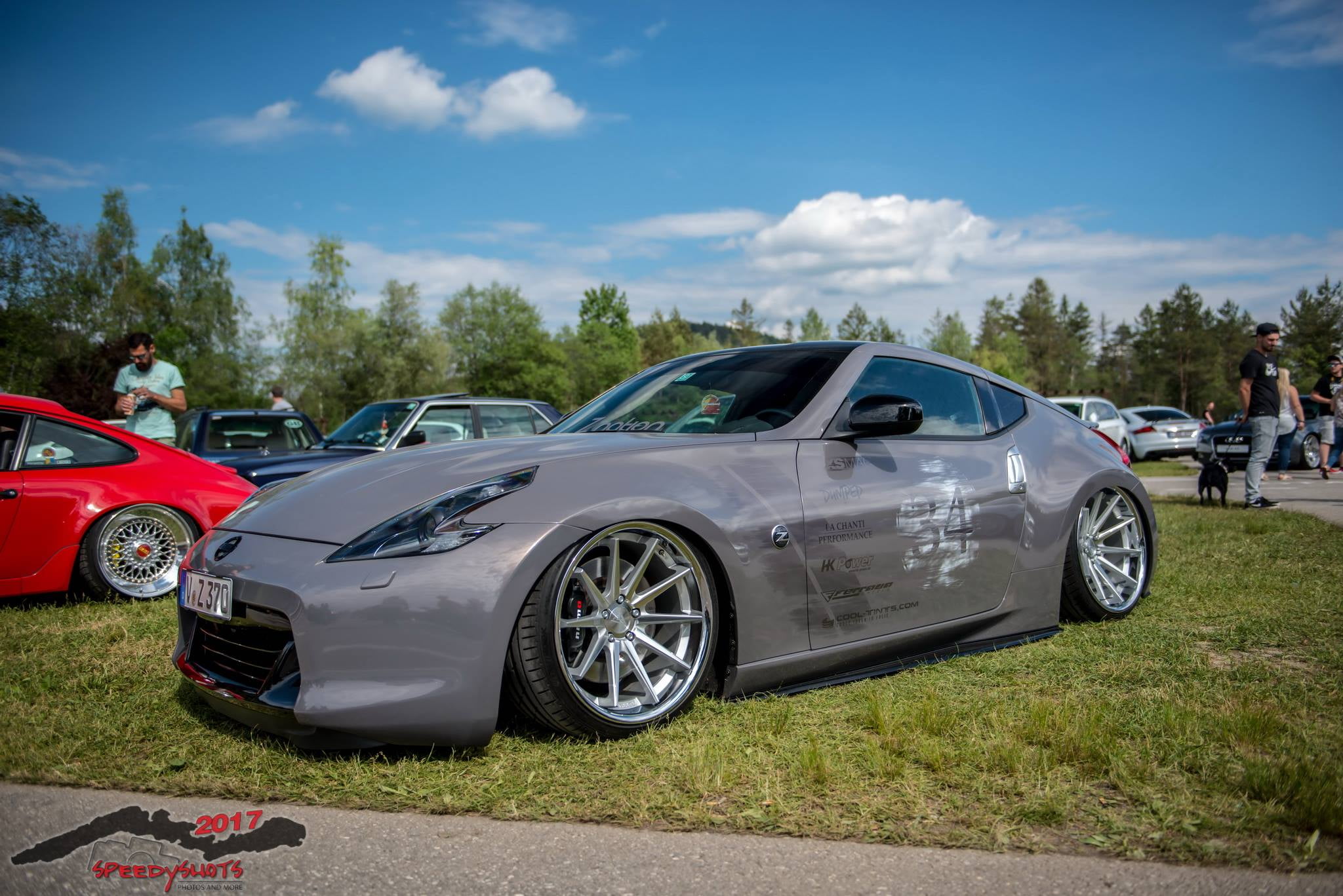 day, tree, Audi, sunlight, motor vehicle, cloud - sky, Nissan 370Z, car, 1080P, land vehicle, Nissan, transportation, nature, road, plant, field, incidental people, HD Wallpaper