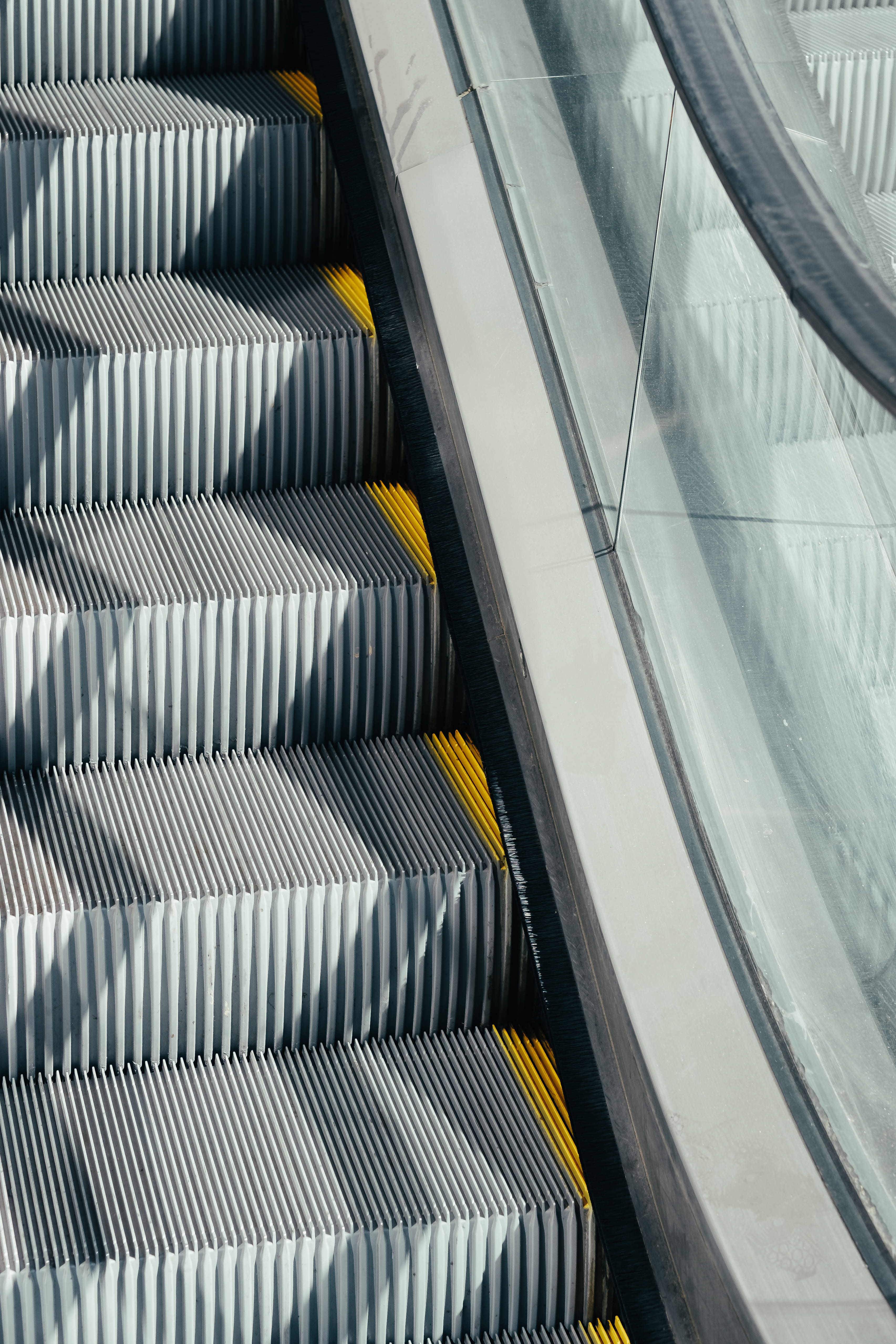 high angle view, geometric, railing, close-up, city, day, striped, architecture, hand rail, black, glass - material, minimal, indoors, metal, moving walkway, Phone HD Wallpaper