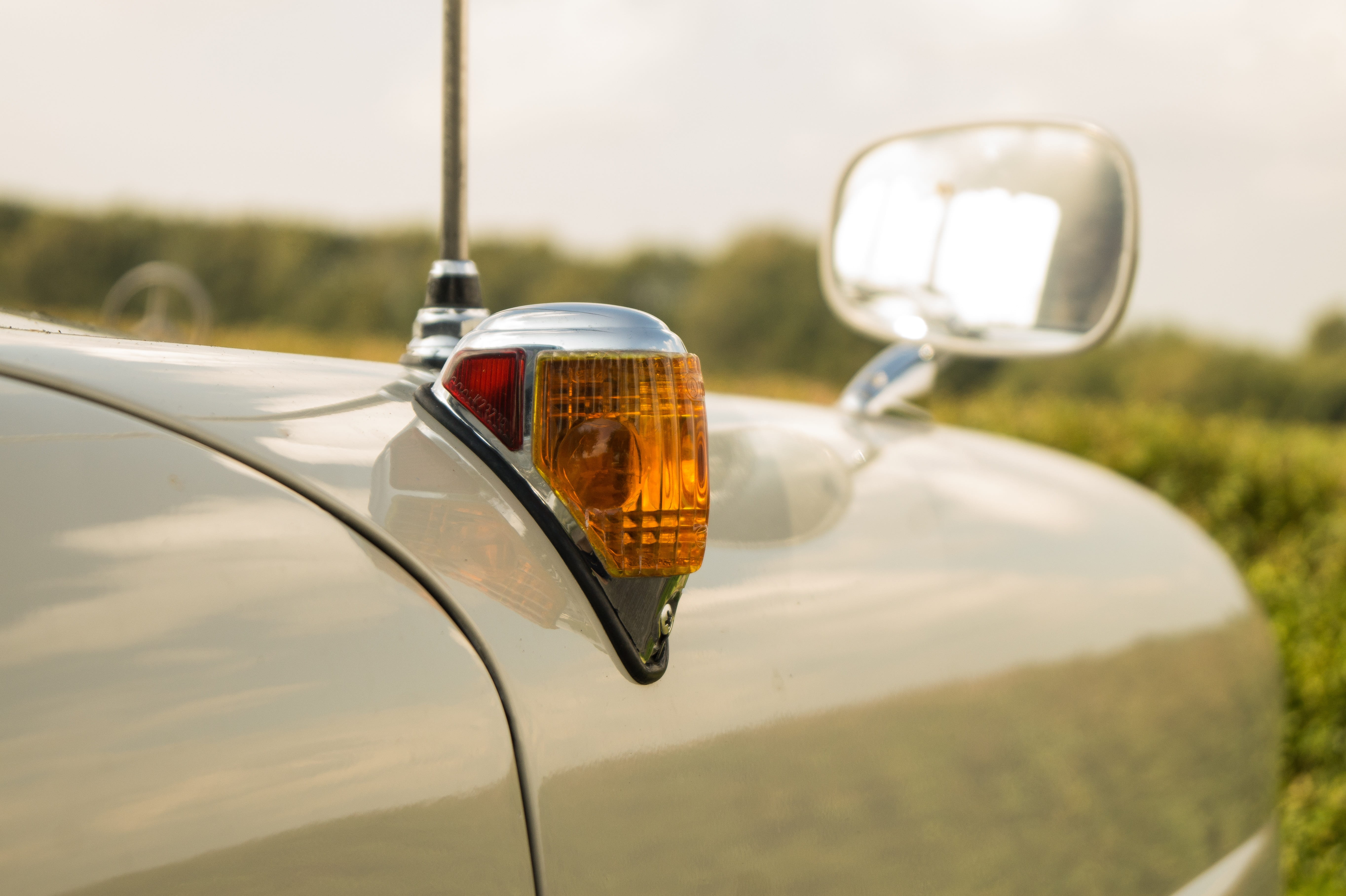 land vehicle, blinker, tailfin, silver colored, reflection, sky, transportation, no people, nature, side-view mirror, vintage car, outdoors, close-up, focus on foreground, HD Wallpaper