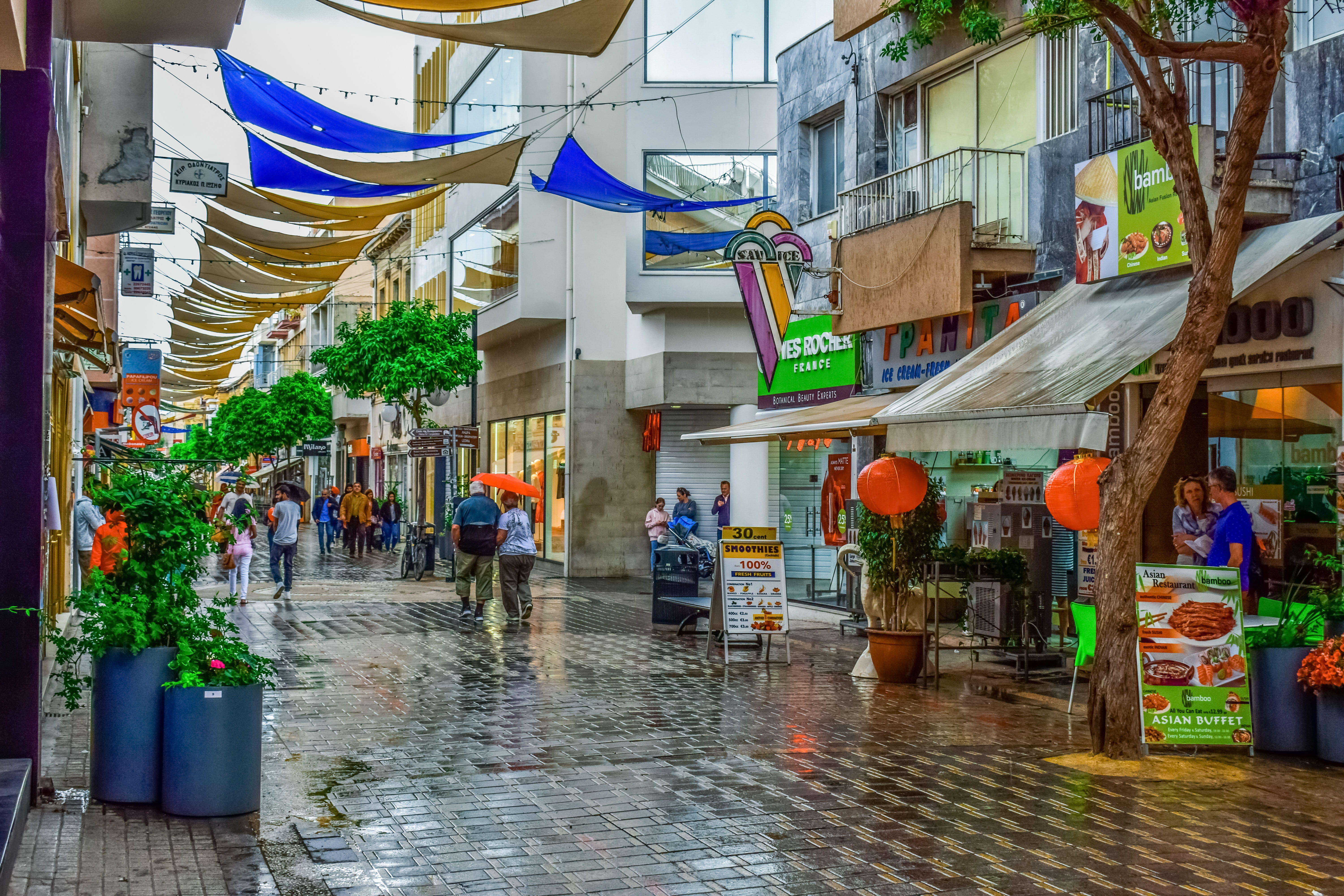 downtown, group of people, men, women, building, rain, real people, cyprus, built structure, walking, building exterior, incidental people, architecture, HD Wallpaper