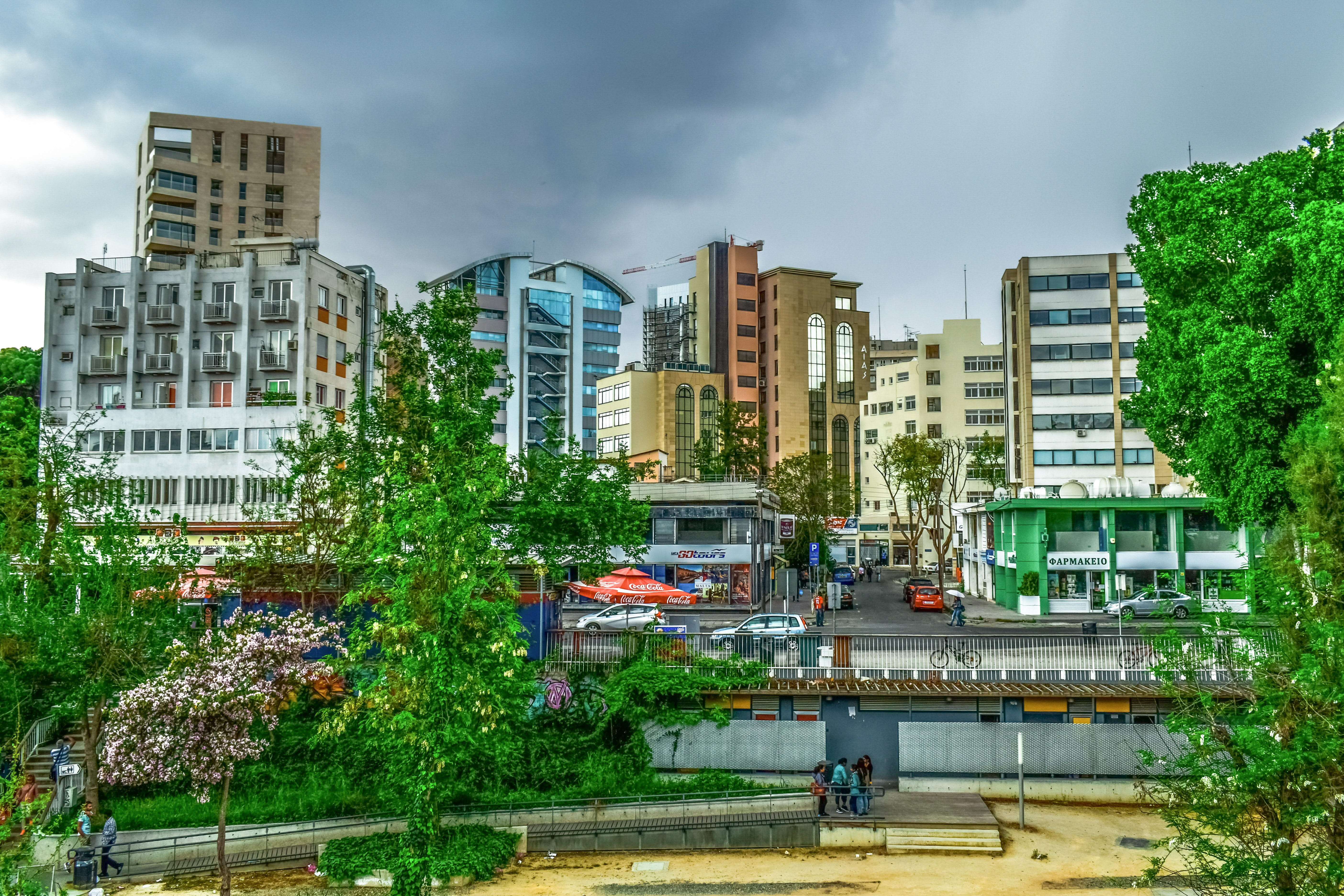 land vehicle, city, nicosia, tree, office building exterior, incidental people, rain, modern, cyprus, outdoors, built structure, cloud - sky, street, transportation, HD Wallpaper